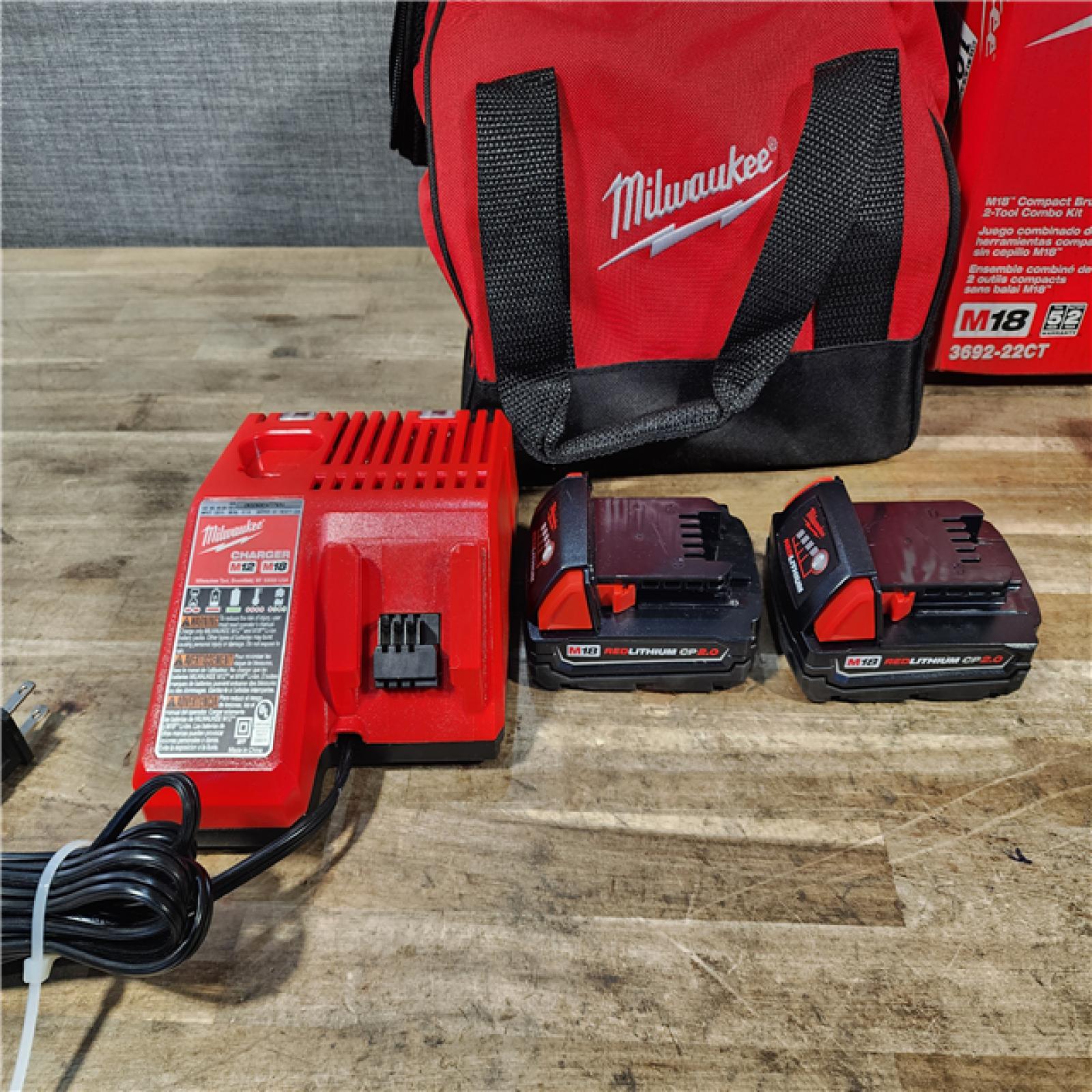 HOUSTON LOCATION - AS-IS Milwaukee M18 18V Lithium-Ion Brushless Cordless Compact Drill/Impact Combo Kit (2-Tool) W/(2) 2.0 Ah Batteries  Charger & Bag