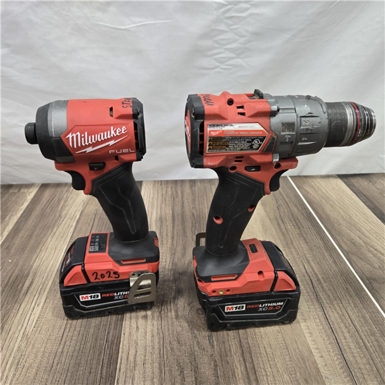 AS-IS MILWAUKEE FUEL 18V Lithium-Ion Brushless Cordless Hammer Drill and Impact Driver Combo Kit (2-Tool) with 2 Batteries