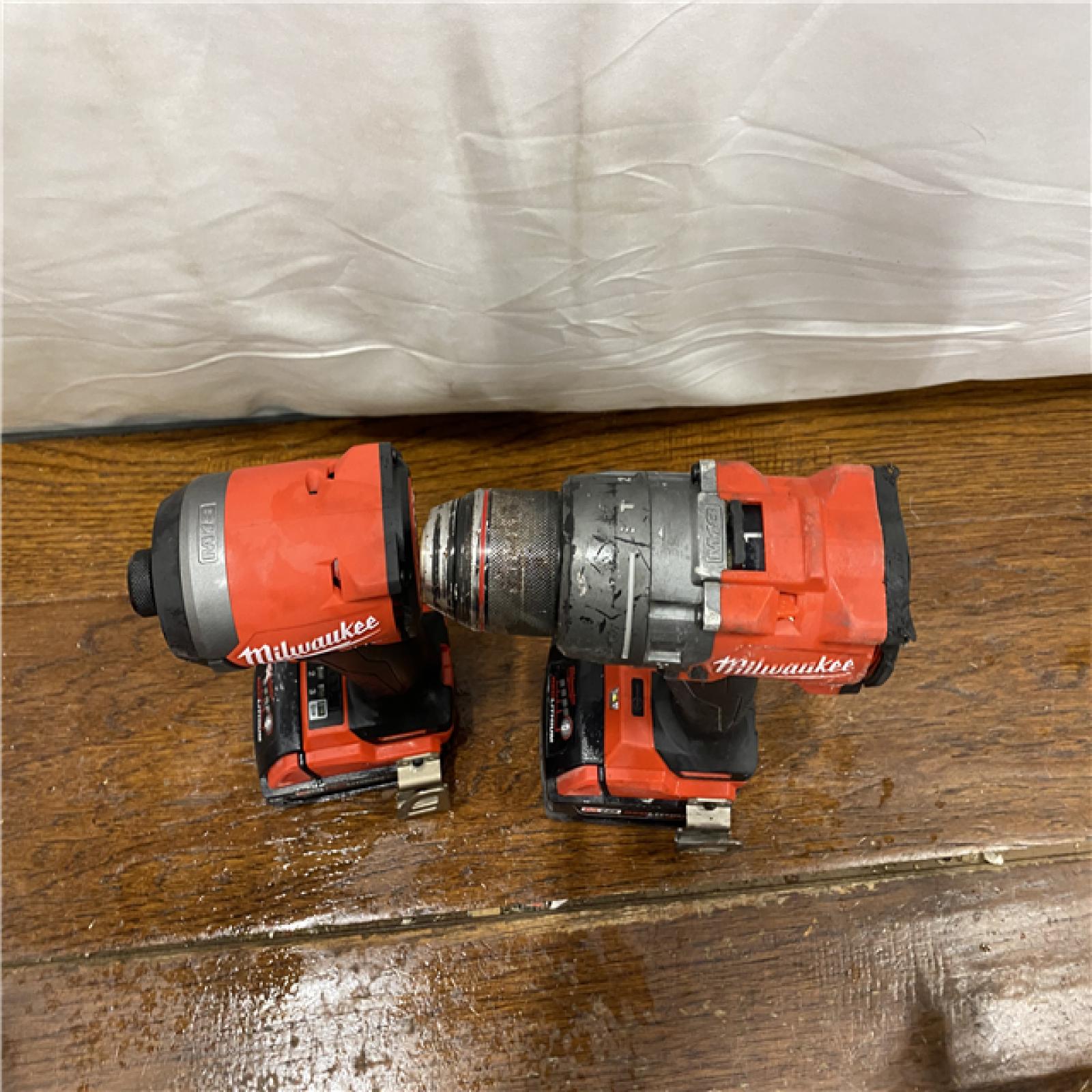 AS-IS MILWAUKEE M18 FUEL 18V Lithium-Ion Brushless Cordless Hammer Drill and Impact Driver Combo Kit (2-Tool) with 2 Batteries