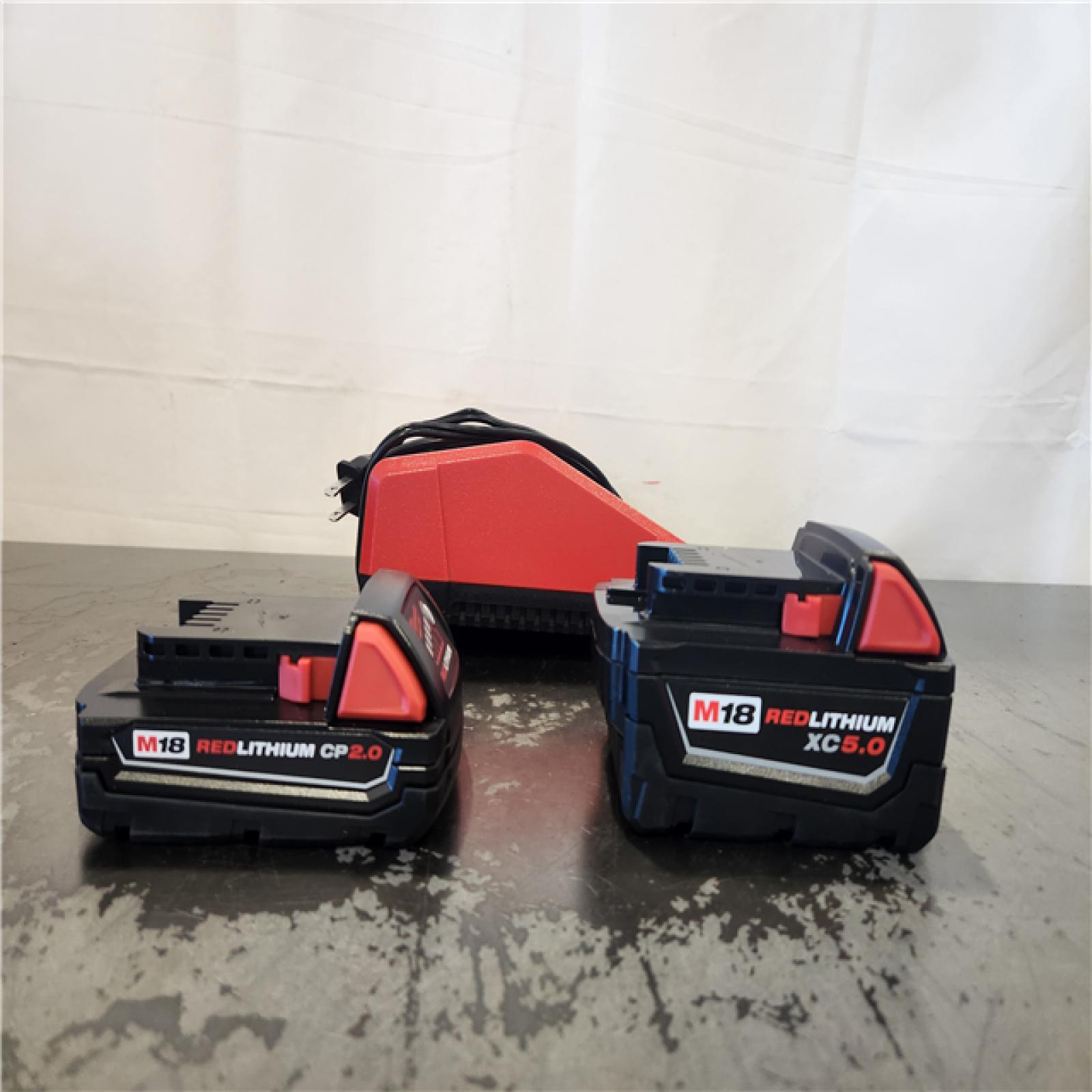 AS-IS- Milwaukee M18 Redlithium Xc5.0 Resistant Battery Starter Kit