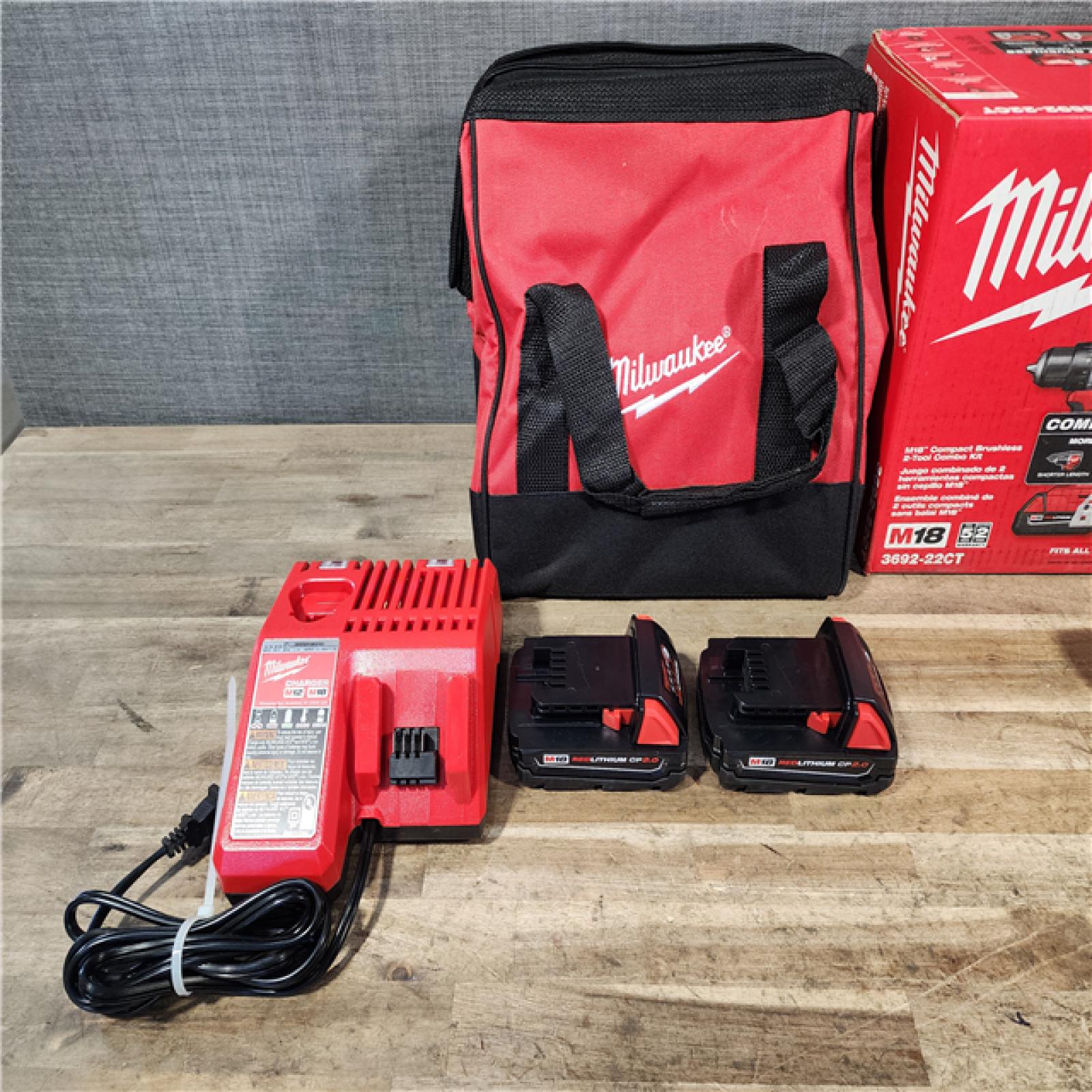 HOUSTON LOCATION - AS-IS Milwaukee M18 18V Lithium-Ion Brushless Cordless Compact Drill/Impact Combo Kit (2-Tool) W/(2) 2.0 Ah Batteries  Charger & Bag