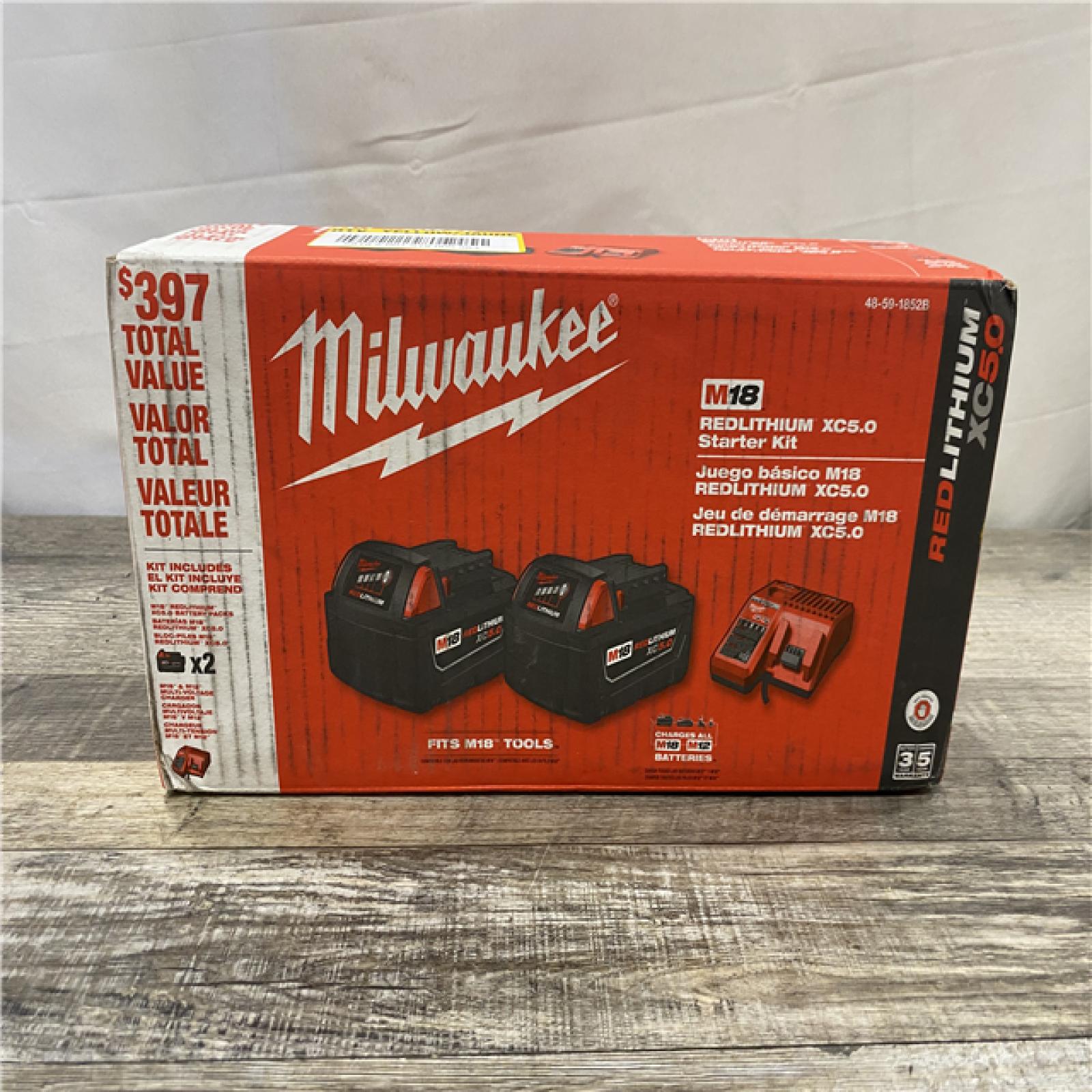 NEW - Milwaukee 18-Volt Lithium-Ion XC Starter Kit with Two 5.0Ah Batteries and Charger