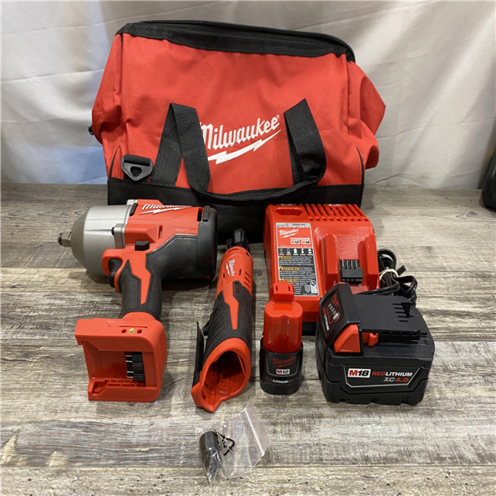 AS-IS Milwaukee 12/18V Lithium-Ion Cordless 3/8 in. Ratchet and 1/2 in. High Torque Impact Wrench with Friction Ring Combo Kit