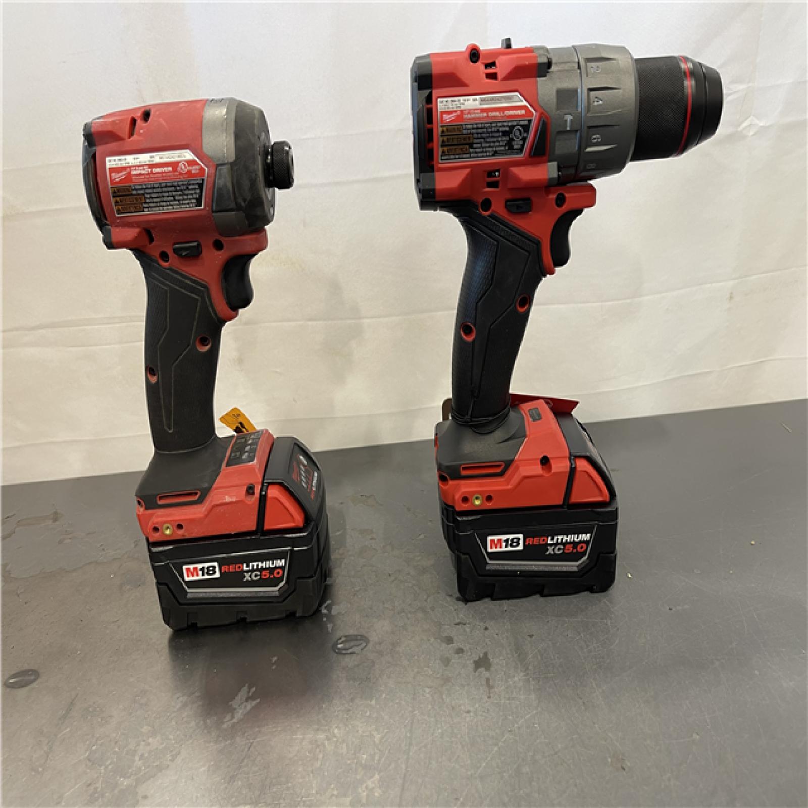 AS-IS- AS-IS - Milwaukee M18 FUEL 18V Lithium-Ion Brushless Cordless Hammer Drill and Impact Driver Combo Kit (2-Tool) with 2 Batteries