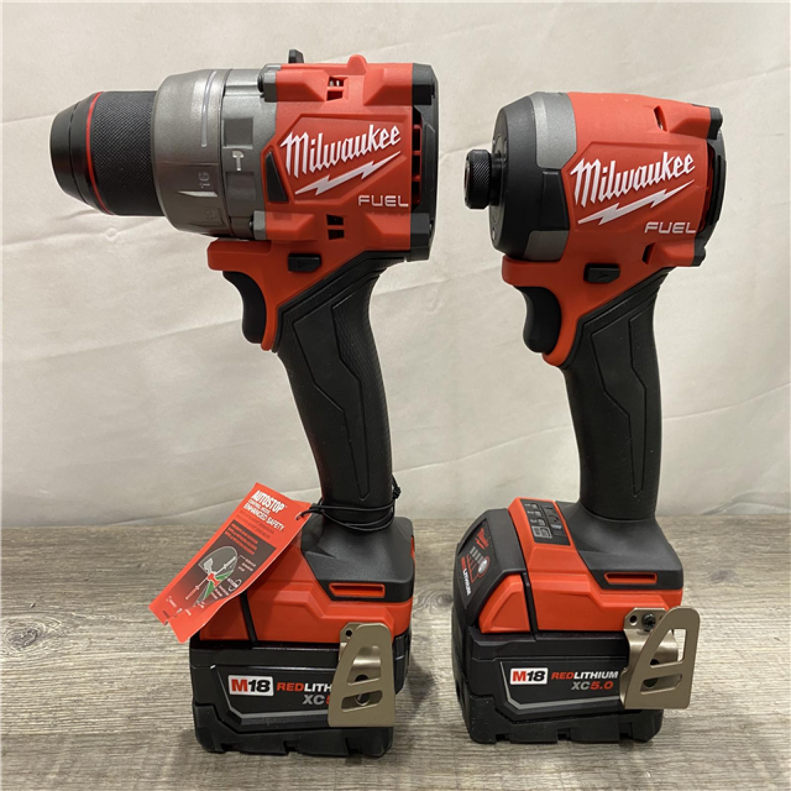 AS-IS Milwaukee FUEL 18V Lithium-Ion Brushless Cordless Hammer Drill and Impact Driver Combo Kit