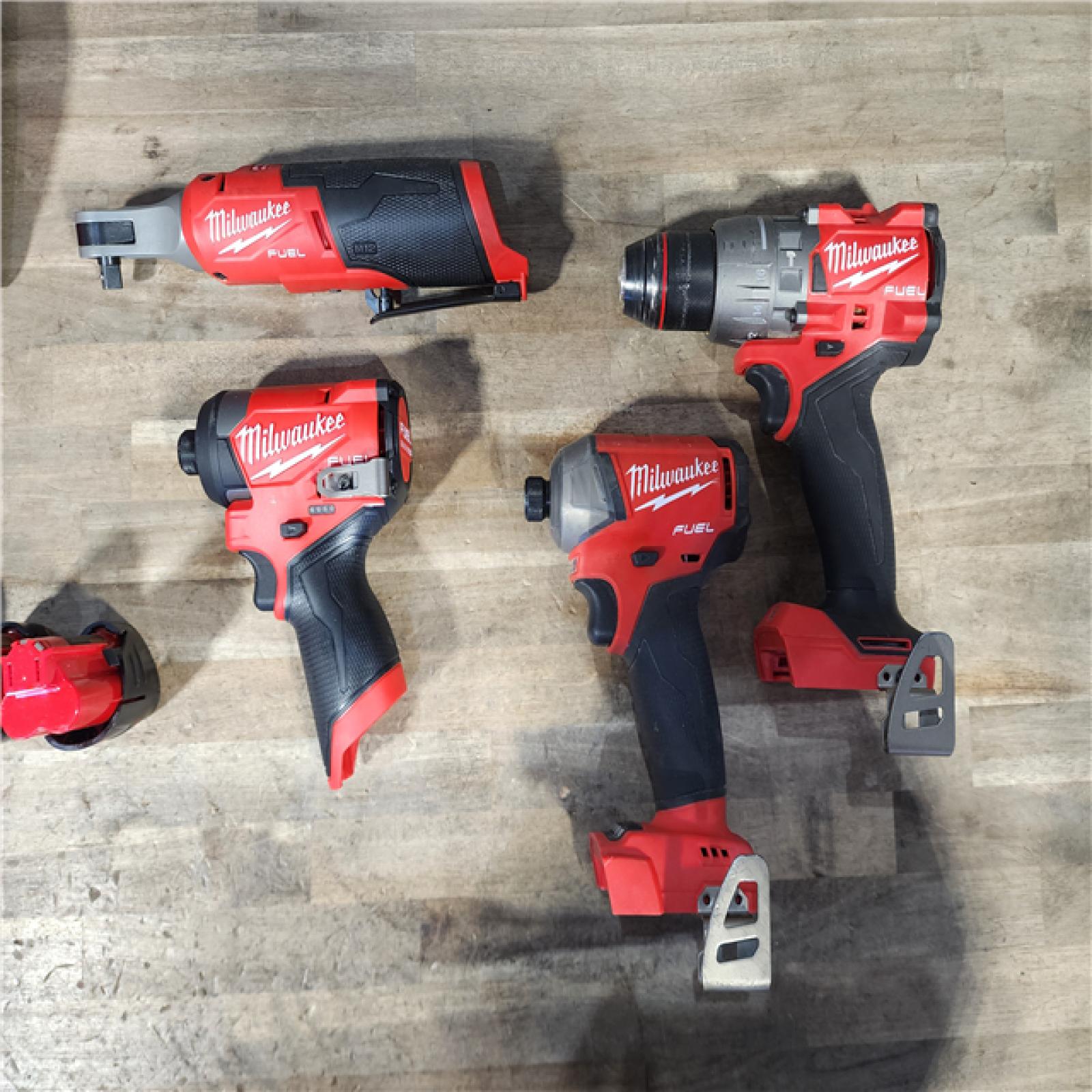 HOUSTON LOCATION - AS-IS MILWAUKEE 4 TOOL COMBO KIT W/ (4) BATTERY & CHARGER
