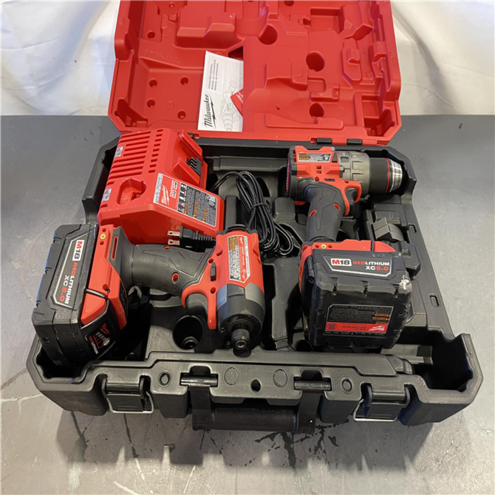 AS-IS - Milwaukee M18 FUEL 18V Lithium-Ion Brushless Cordless Hammer Drill and Impact Driver Combo Kit
