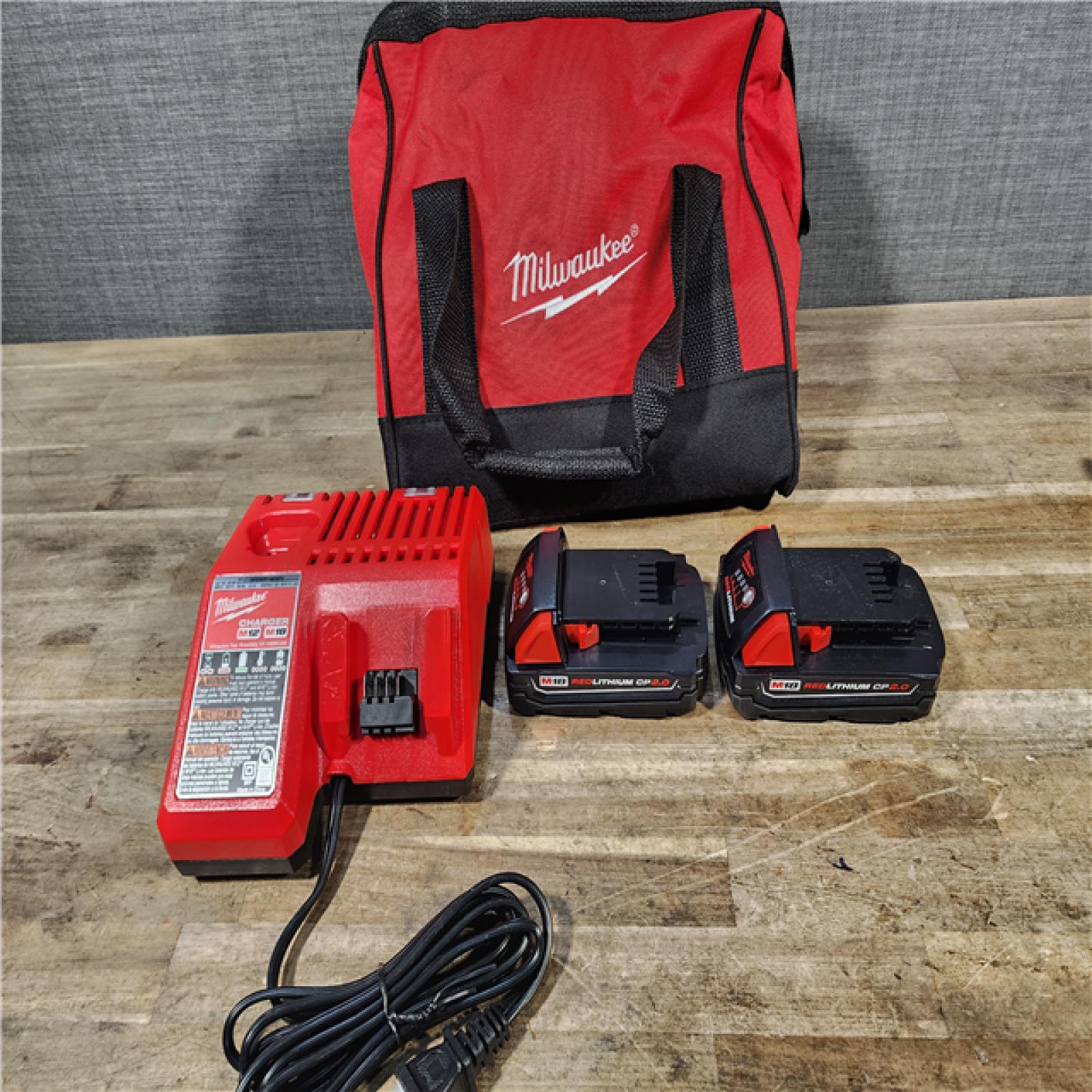 HOUSTON LOCATION - AS-IS Milwaukee M18 18V Lithium-Ion Brushless Cordless Compact Drill/Impact Combo Kit (2-Tool) W/(2) 2.0 Ah Batteries  Charger & Bag