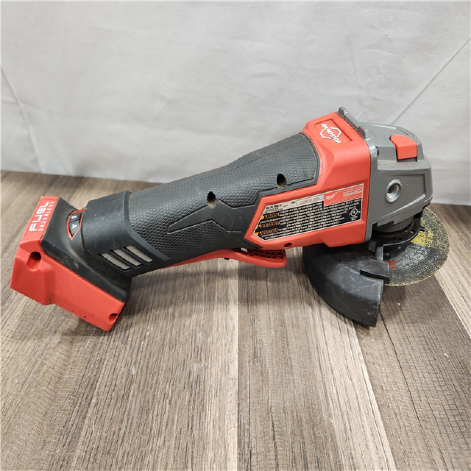 AS-IS- Milwaukee M18 FUEL 18V Lithium-Ion Brushless Cordless 4-1/2 in./5 in. Grinder with Variable Speed & Paddle Switch (Tool-Only)