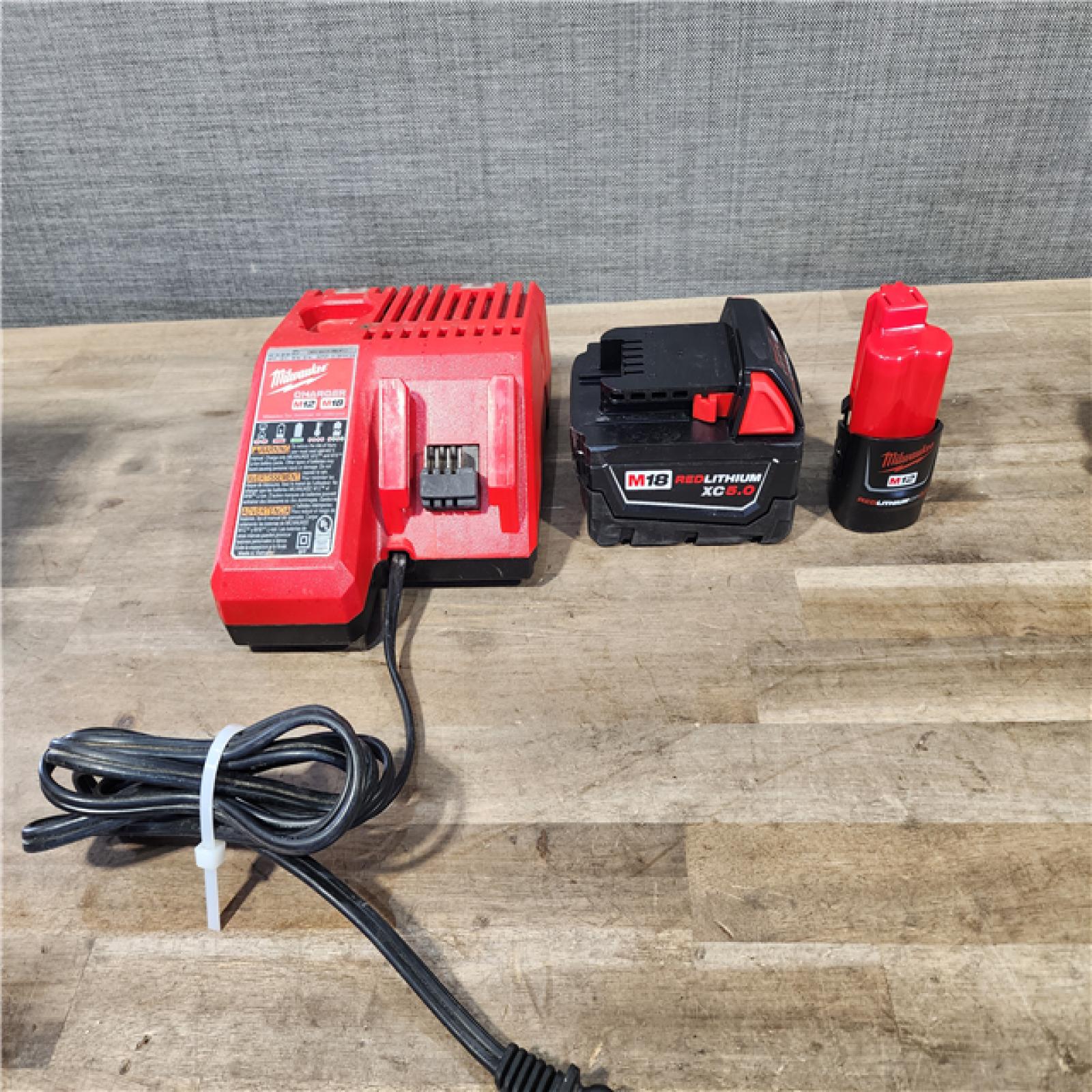 HOUSTON LOCATION - AS-IS Milwaukee M12/M18 12/18V Lithium-Ion Cordless 3/8 in. Ratchet and 1/2 in. High Torque Impact Wrench with Friction Ring Combo Kit