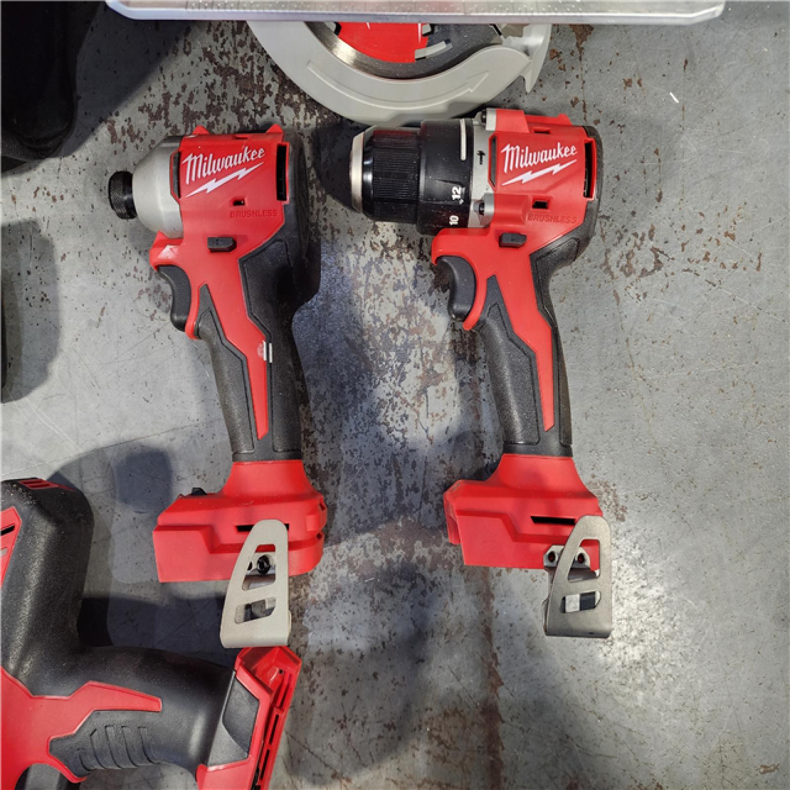 HOUSTON LOCATION - AS-IS Milwaukee M18 18-Volt Lithium-Ion Brushless Cordless Combo Kit (4-Tool) with 2-Batteries, 1-Charger and Tool Bag