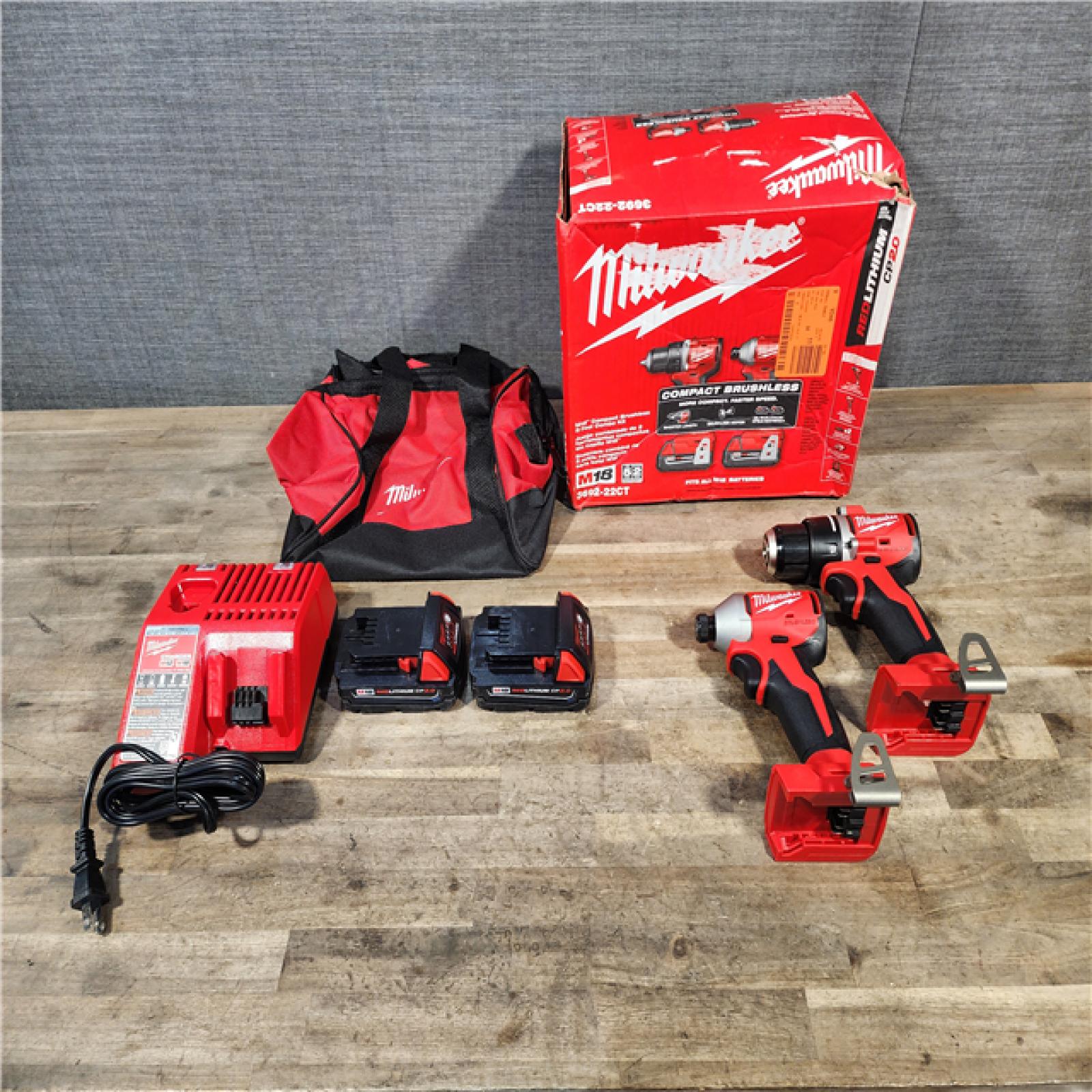 HOUSTON LOCATION - AS-IS Milwaukee M18 18V Lithium-Ion Brushless Cordless Compact Drill/Impact Combo Kit (2-Tool) W/(2) 2.0 Ah Batteries  Charger & Bag