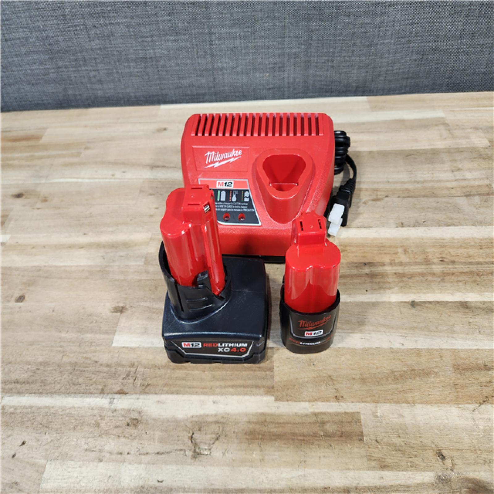 HOUSTON LOCATION - AS-IS MILWAUKEE 2 TOOL COMBO KIT W/ (2) BATTERY & CHARGER