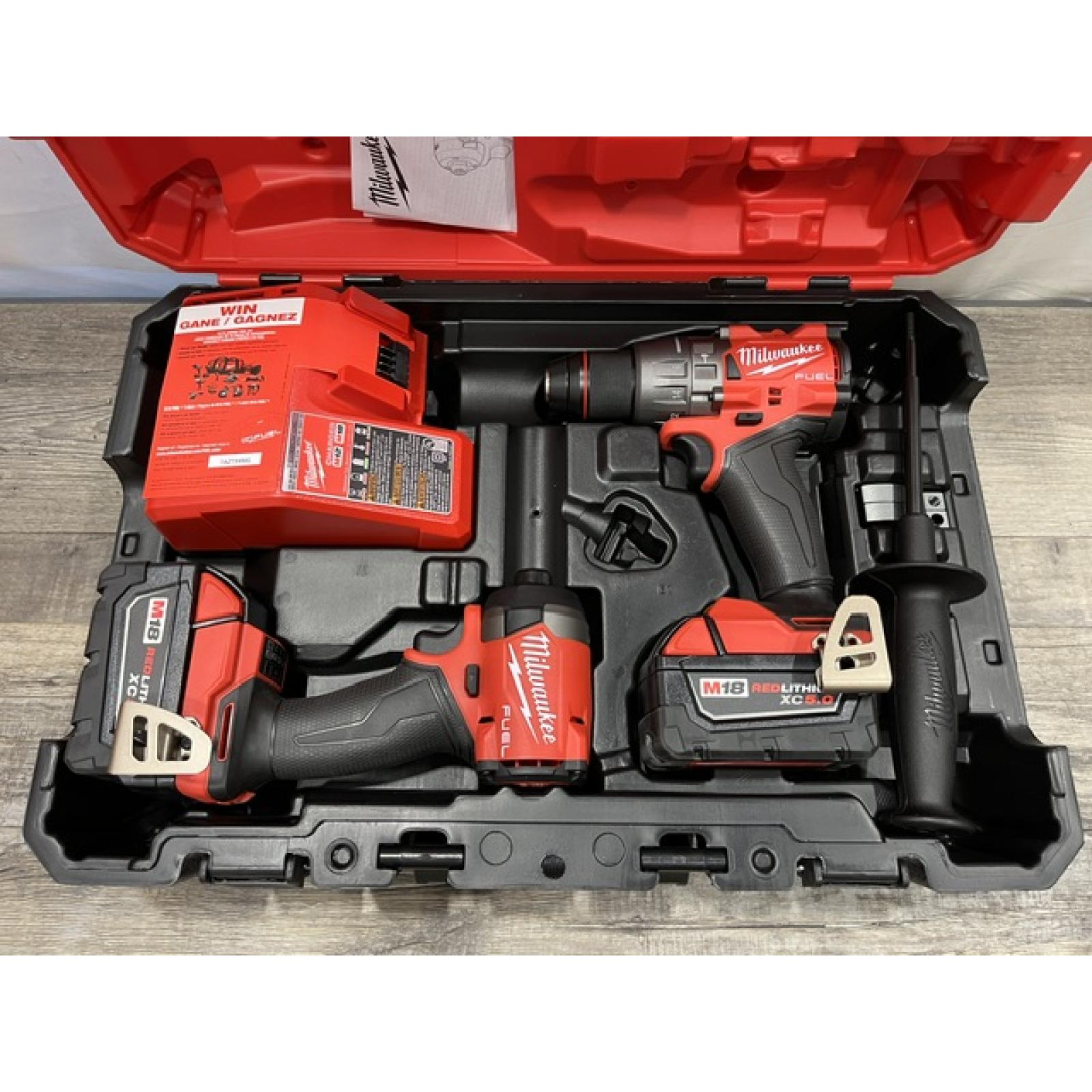 AS-IS Milwaukee FUEL 18V Lithium-Ion Brushless Cordless Hammer Drill and Impact Driver Combo Kit
