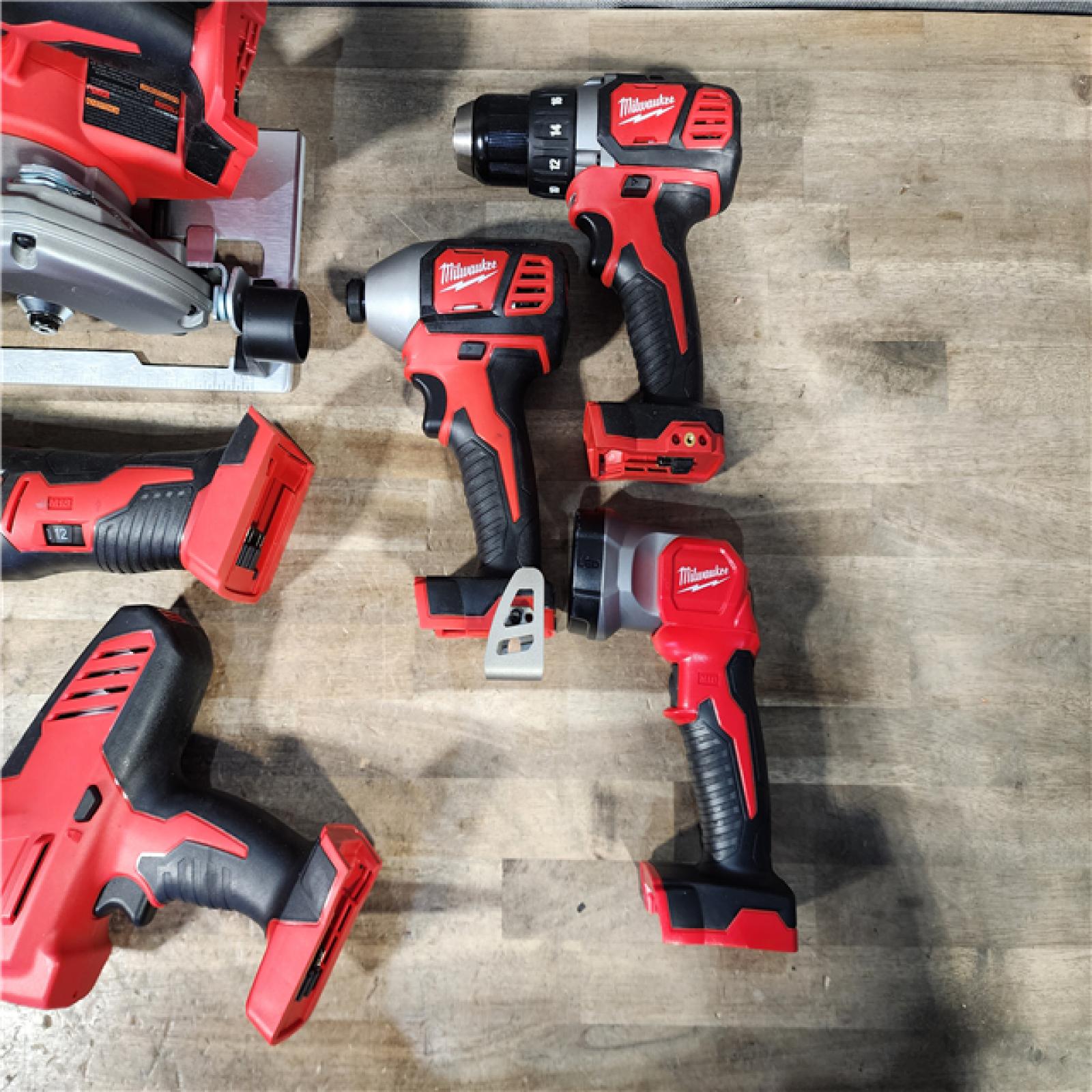HOUSTON LOCATION - AS-IS MILWAUKEE 7 TOOL COMBO KIT W/ (2) BATTERY & CHARGER