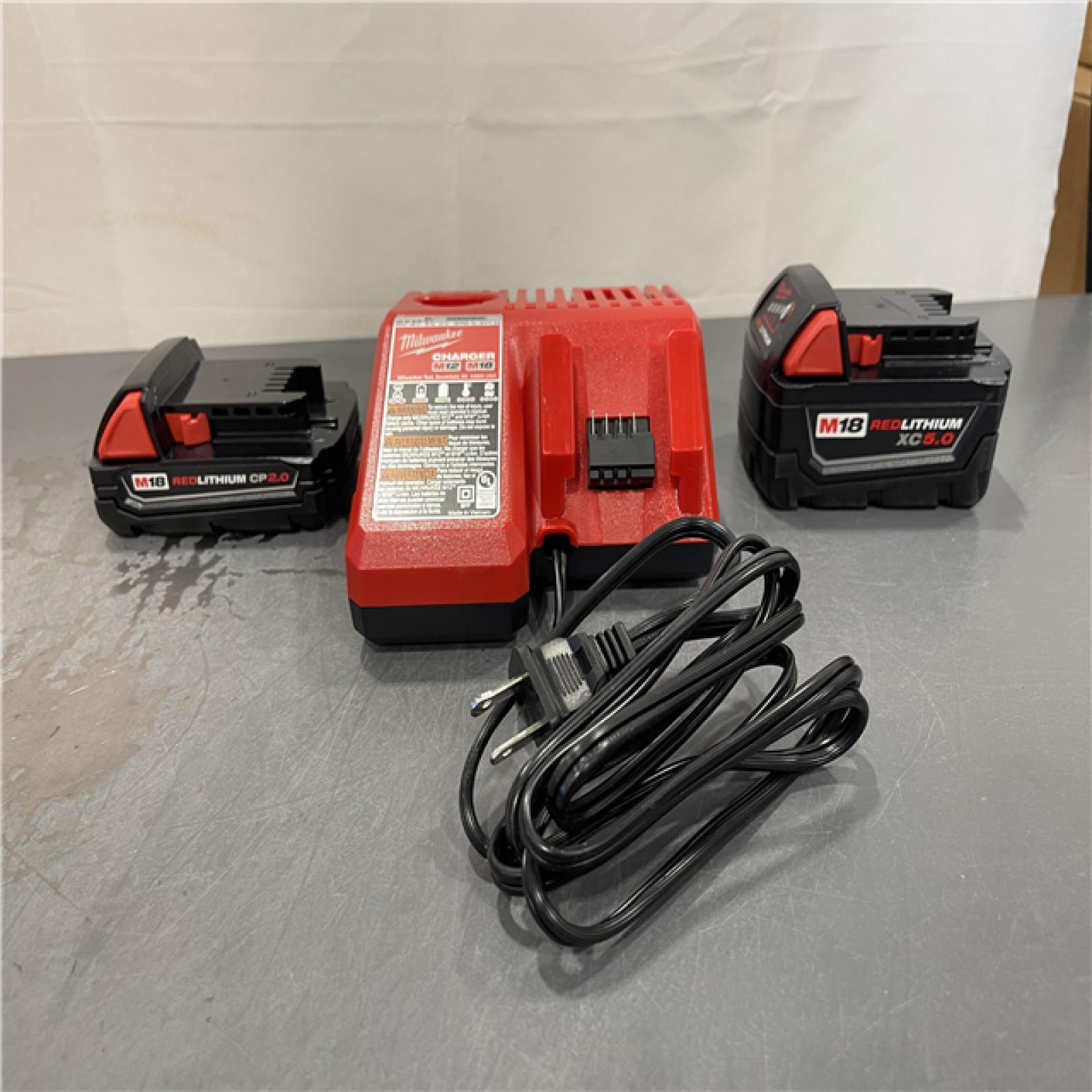 AS-IS - Milwaukee M18 18-Volt Lithium-Ion Starter Kit with One 5.0 Ah and One 2.0 Ah Battery and Charger