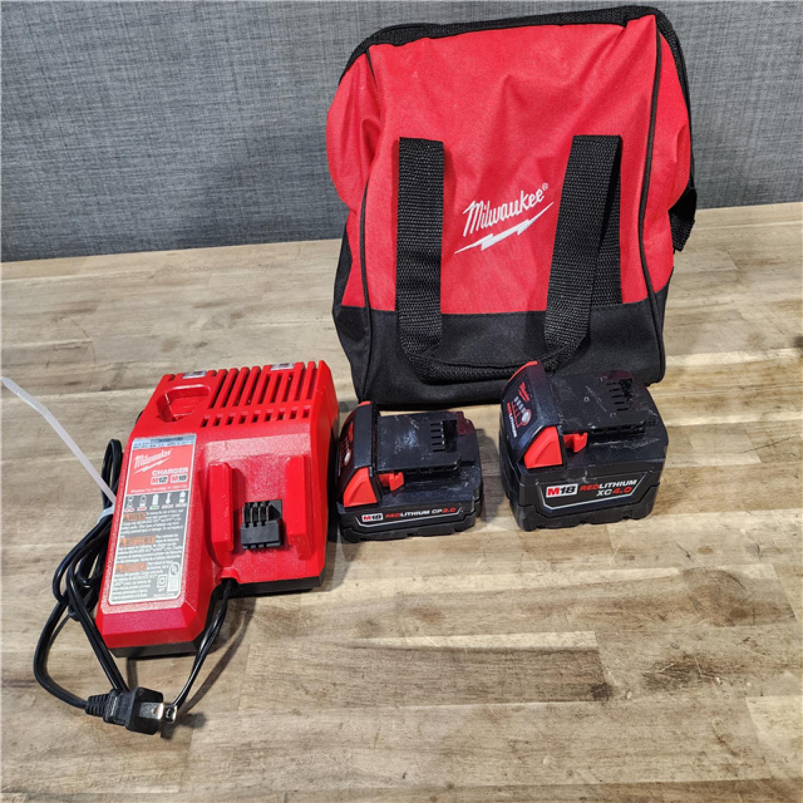 HOUSTON LOCATION - AS-IS M18 18-Volt Lithium-Ion Brushless Cordless Compact Hammer Drill/Impact Combo Kit (2-Tool) with (2) Batteries, Bag