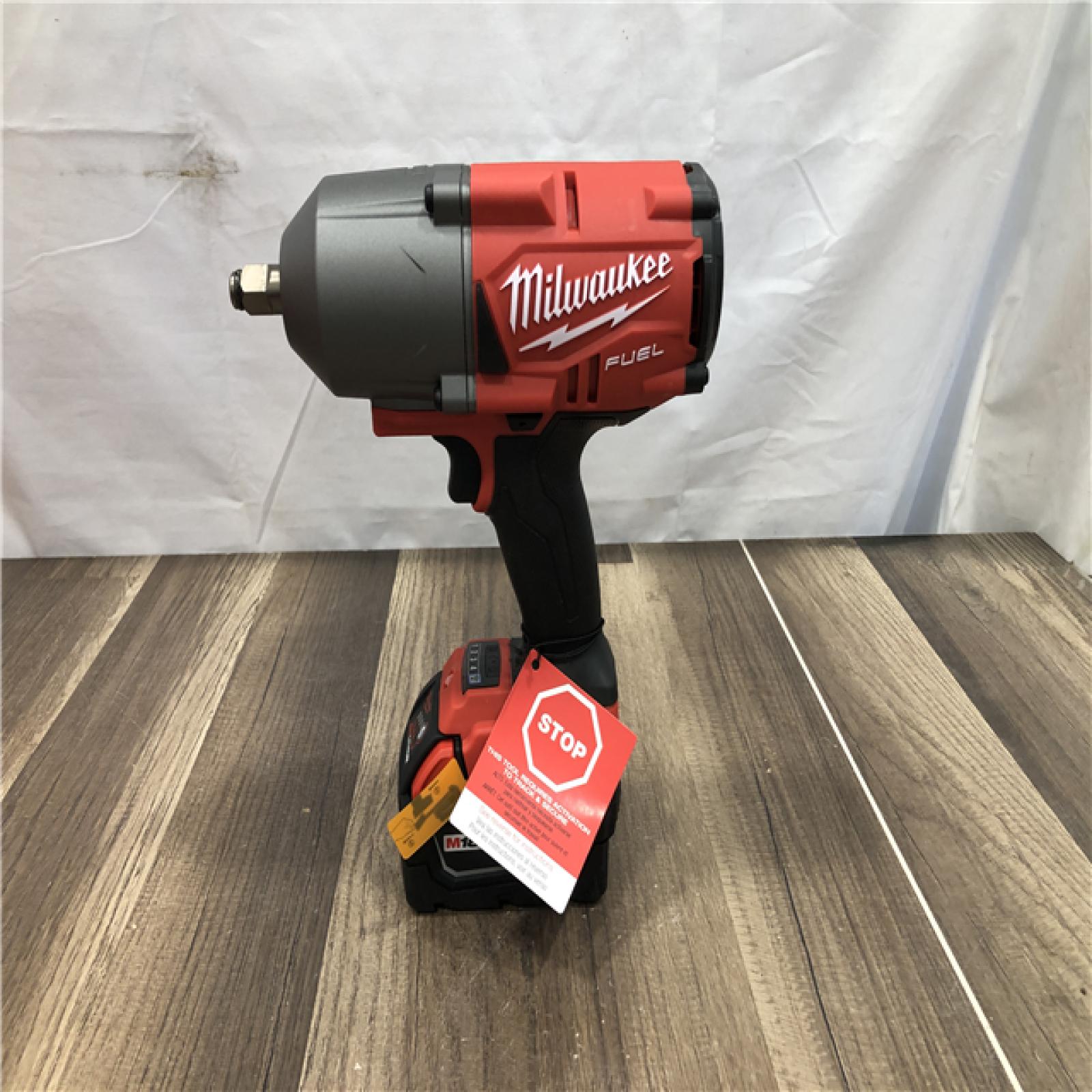 AS-IS Milwaukee FUEL ONE-KEY 18V Li-Ion Brushless Cordless 1/2 in. High-Torque Impact Wrench with Friction Ring  Resistant Batteries