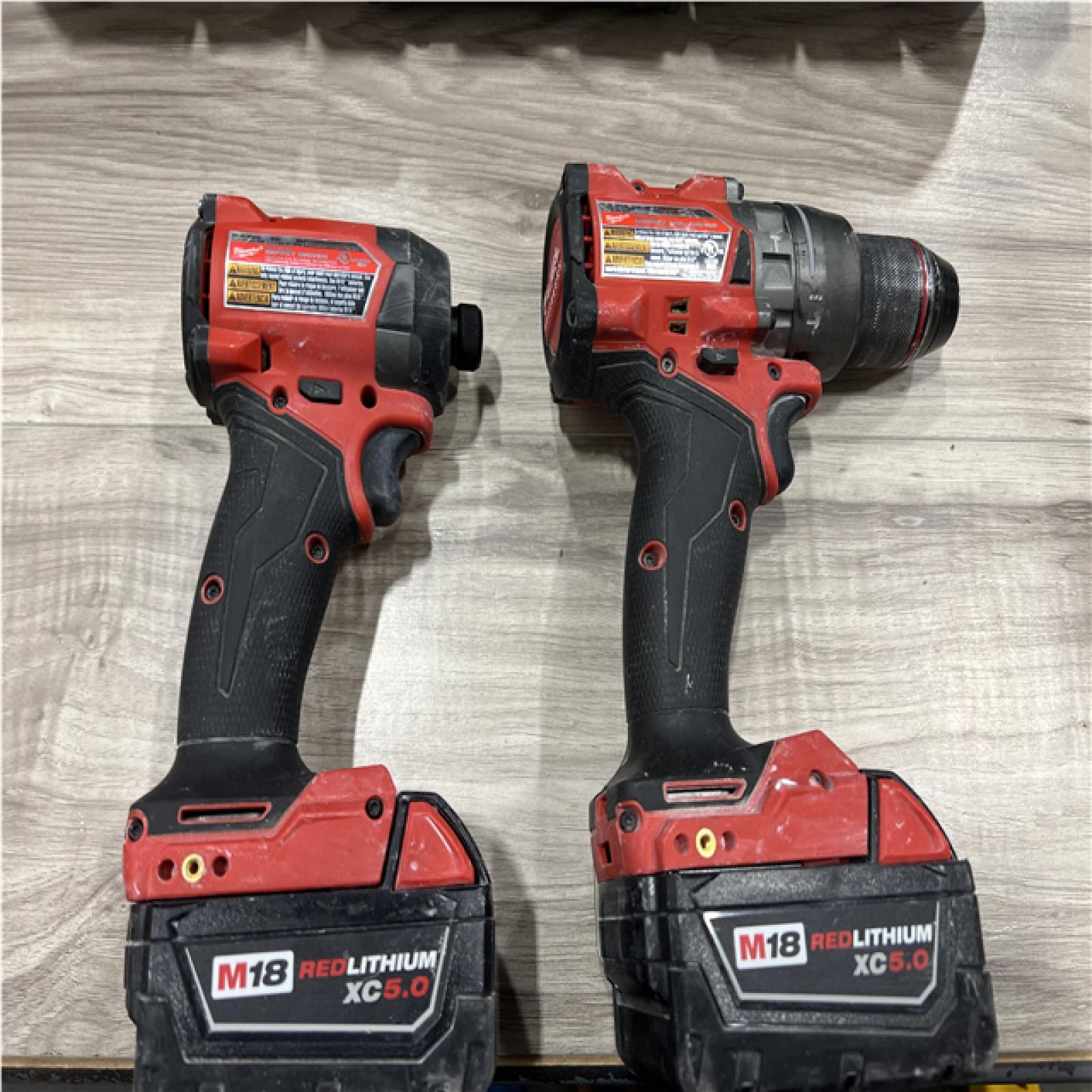 AS-IS Milwaukee FUEL 18V Lithium-Ion Brushless Cordless Hammer Drill and Impact Driver Combo Kit