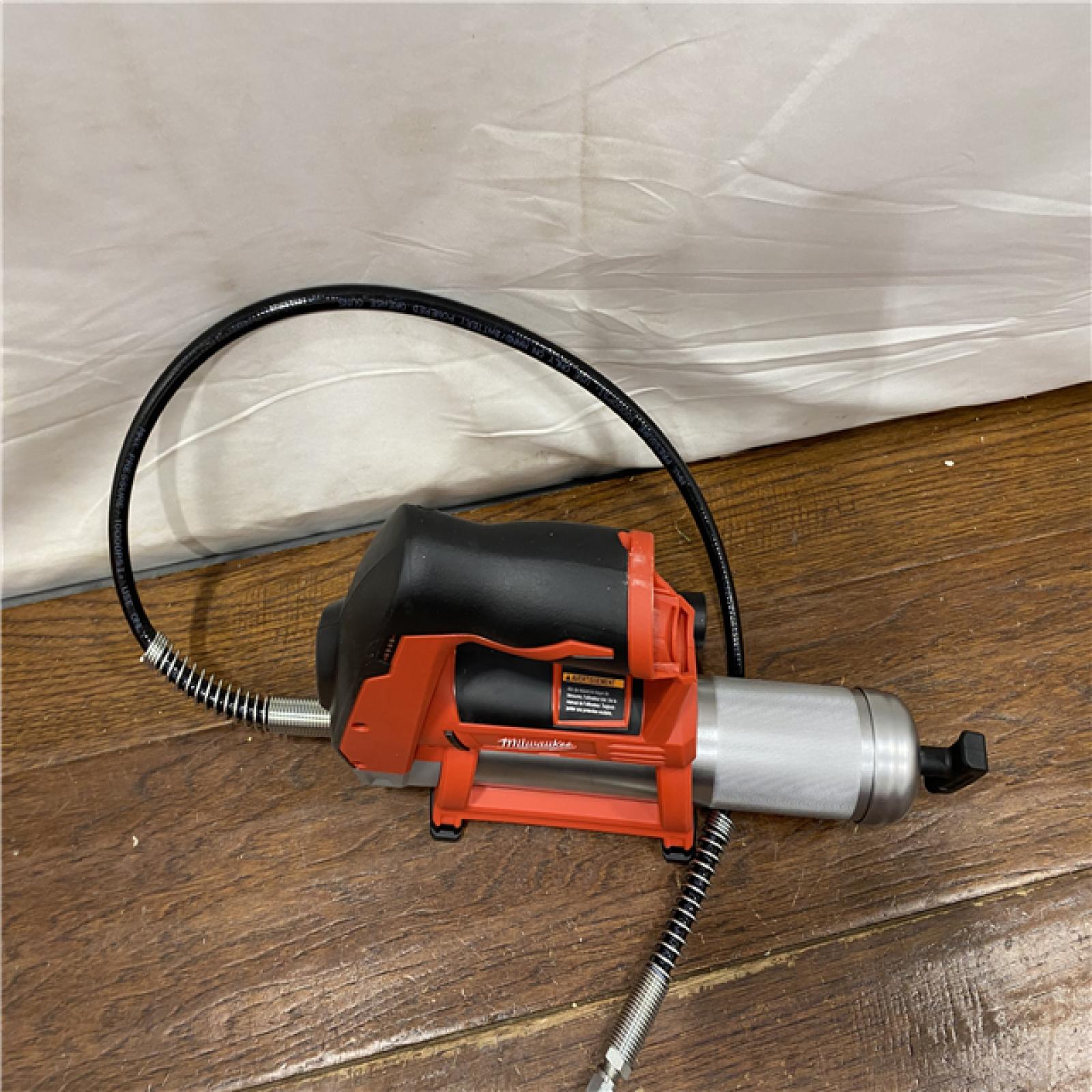 AS-IS Milwaukee Tool 10,000 PSI 14 Oz Battery-Operated Grease Gun - 48 Flexible Hose, 31 Strokes/oz | Part #2646-20
