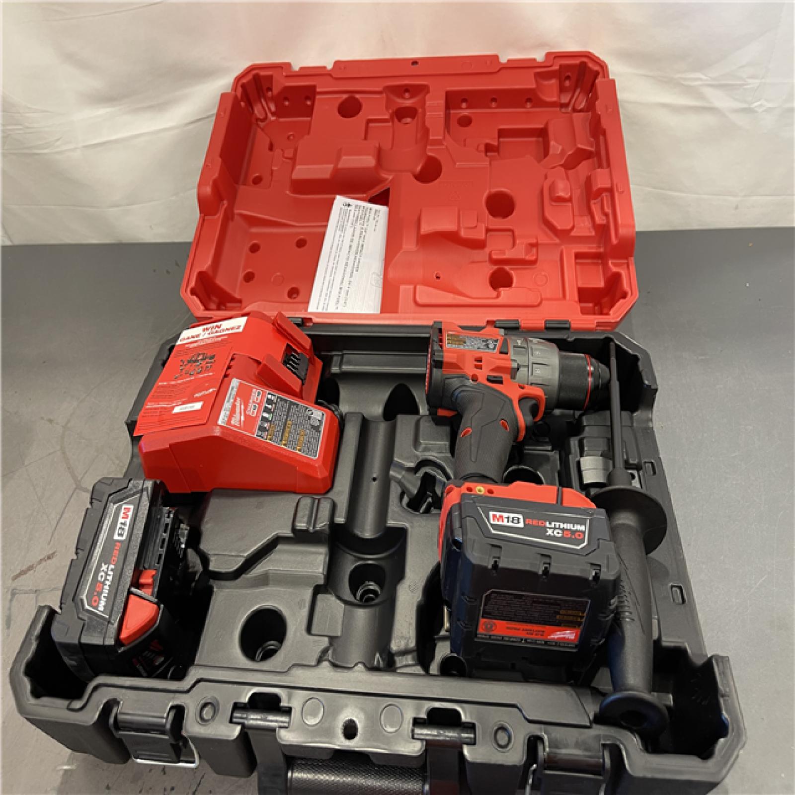 AS-IS - Milwaukee M18 FUEL 18V Lithium-Ion Brushless Cordless 1/2 in. Hammer Drill Driver Kit