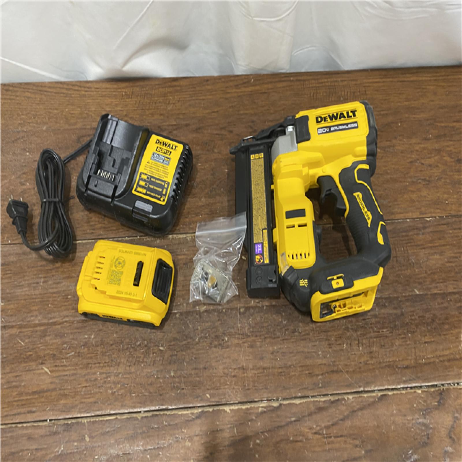 AS-IS DEWALT ATOMIC 20V MAX Lithium Ion Cordless 23 Gauge Pin Nailer Kit with 3.0Ah Battery and Charger