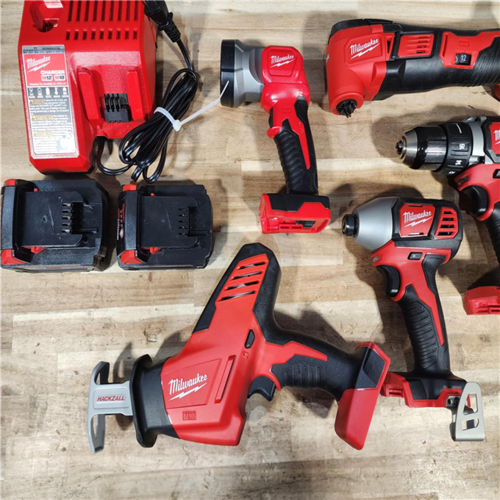 HOUSTON LOCATION - AS-IS MILWAUKEE 5 TOOL COMBO KIT W/ (2) BATTERY & CHARGER