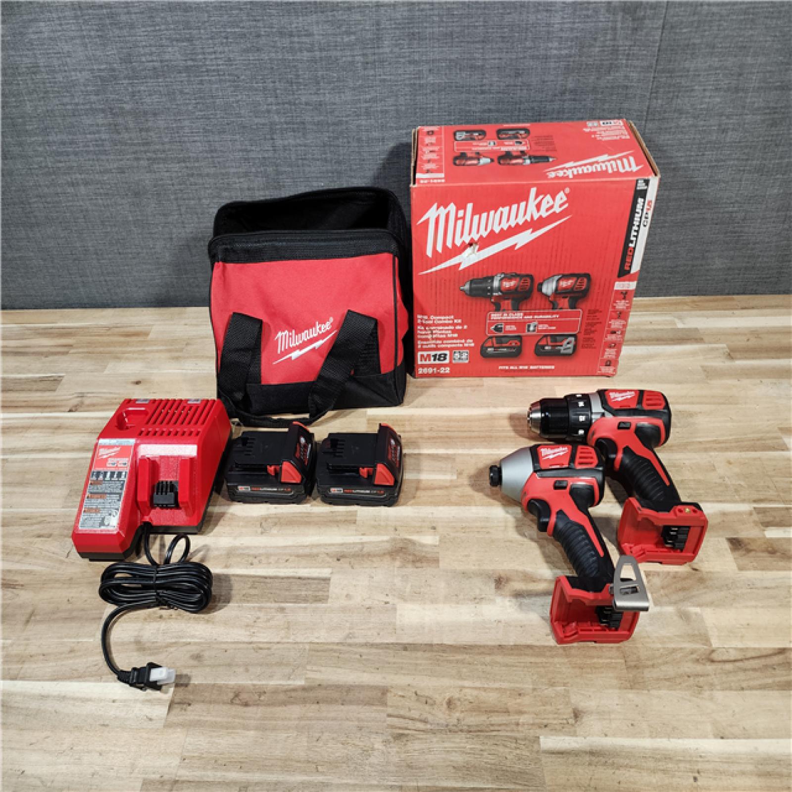 HOUSTON LOCATION - AS-IS (APPEARS LIKE NEW) Milwaukee 18V Lithium-Ion Cordless Drill Driver/Impact Driver Combo Kit