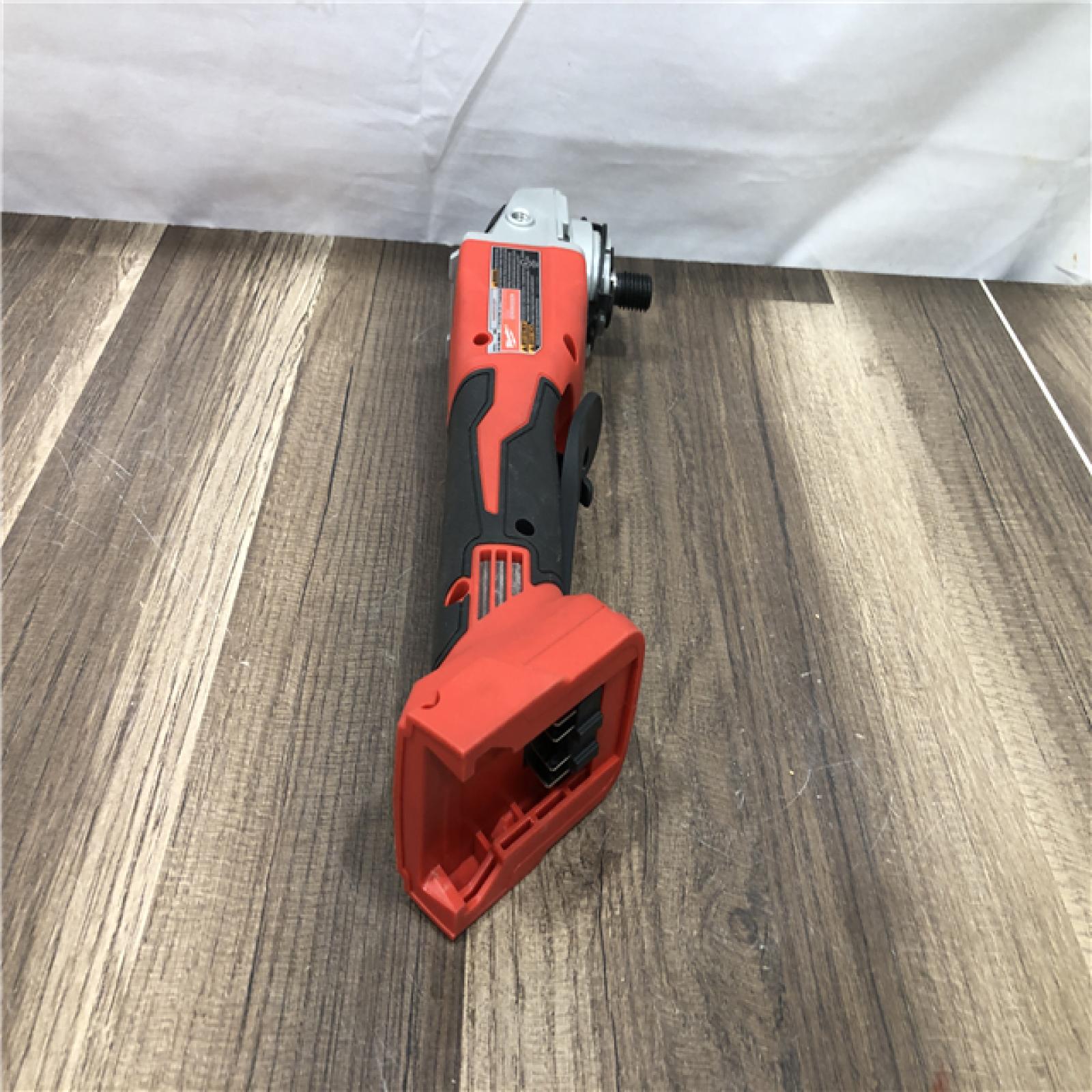 AS-IS Milwaukee 18V Lithium-Ion Brushless Cordless 4-1/2 in./5 in. Grinder w/Paddle Switch (Tool-Only)