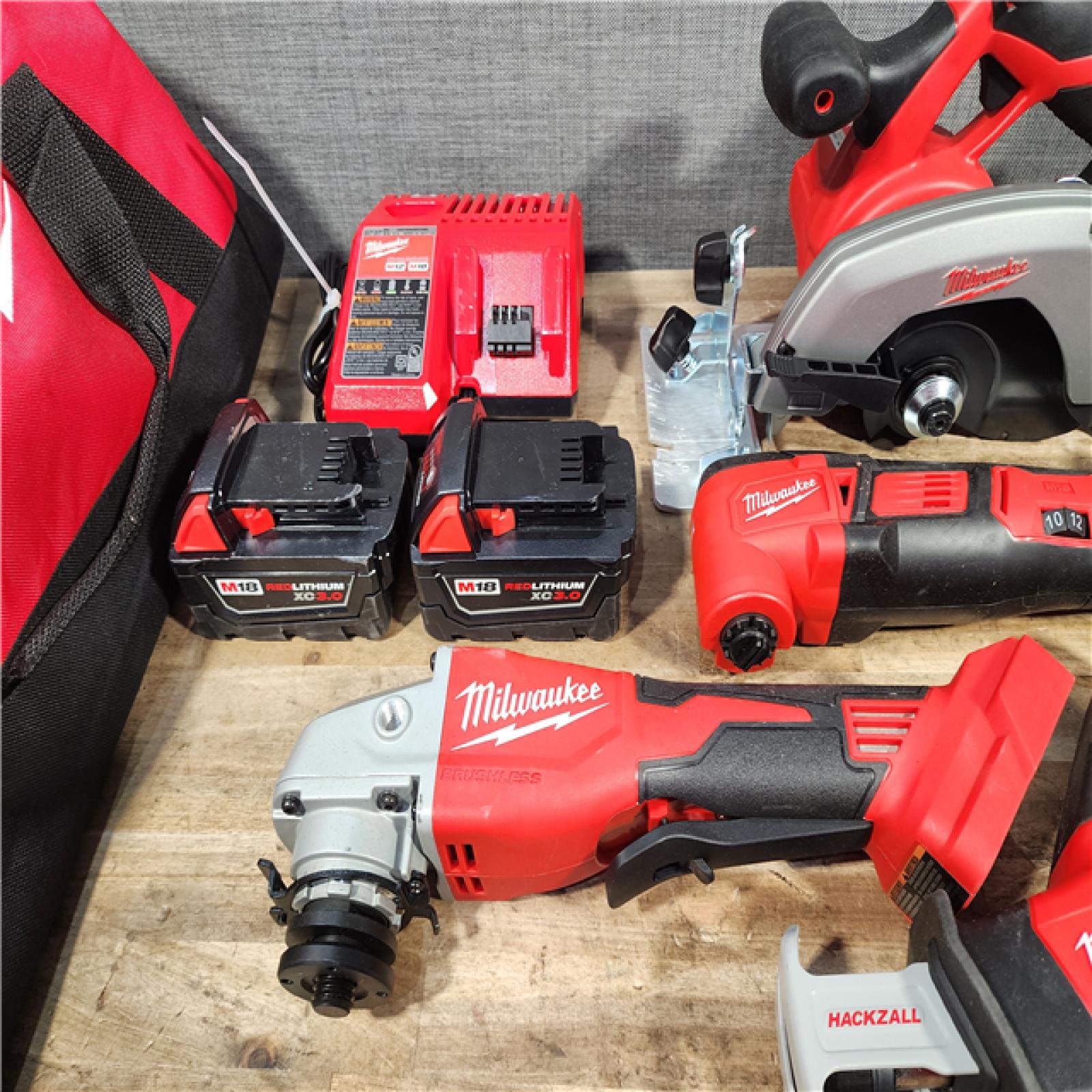 HOUSTON LOCATION - AS-IS MILWAUKEE 7 TOOL COMBO KIT W/ (2) BATTERY & CHARGER