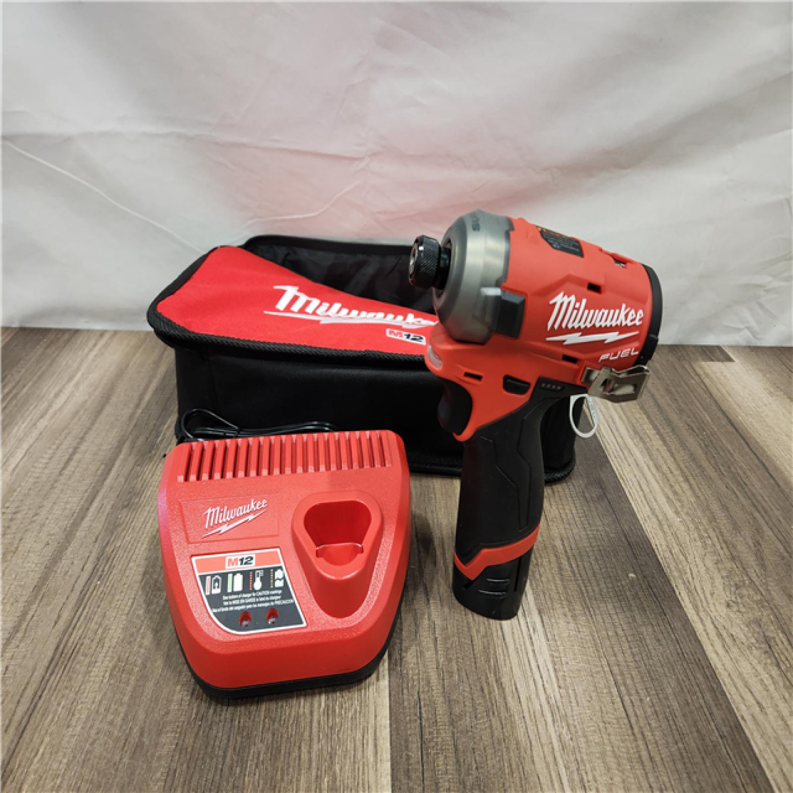 AS-IS Milwaukee M12 FUEL SURGE 12V Lithium-Ion Brushless Cordless 1/4 in. Hex Impact Driver Compact Kit w/Two 2.0Ah Batteries, Bag