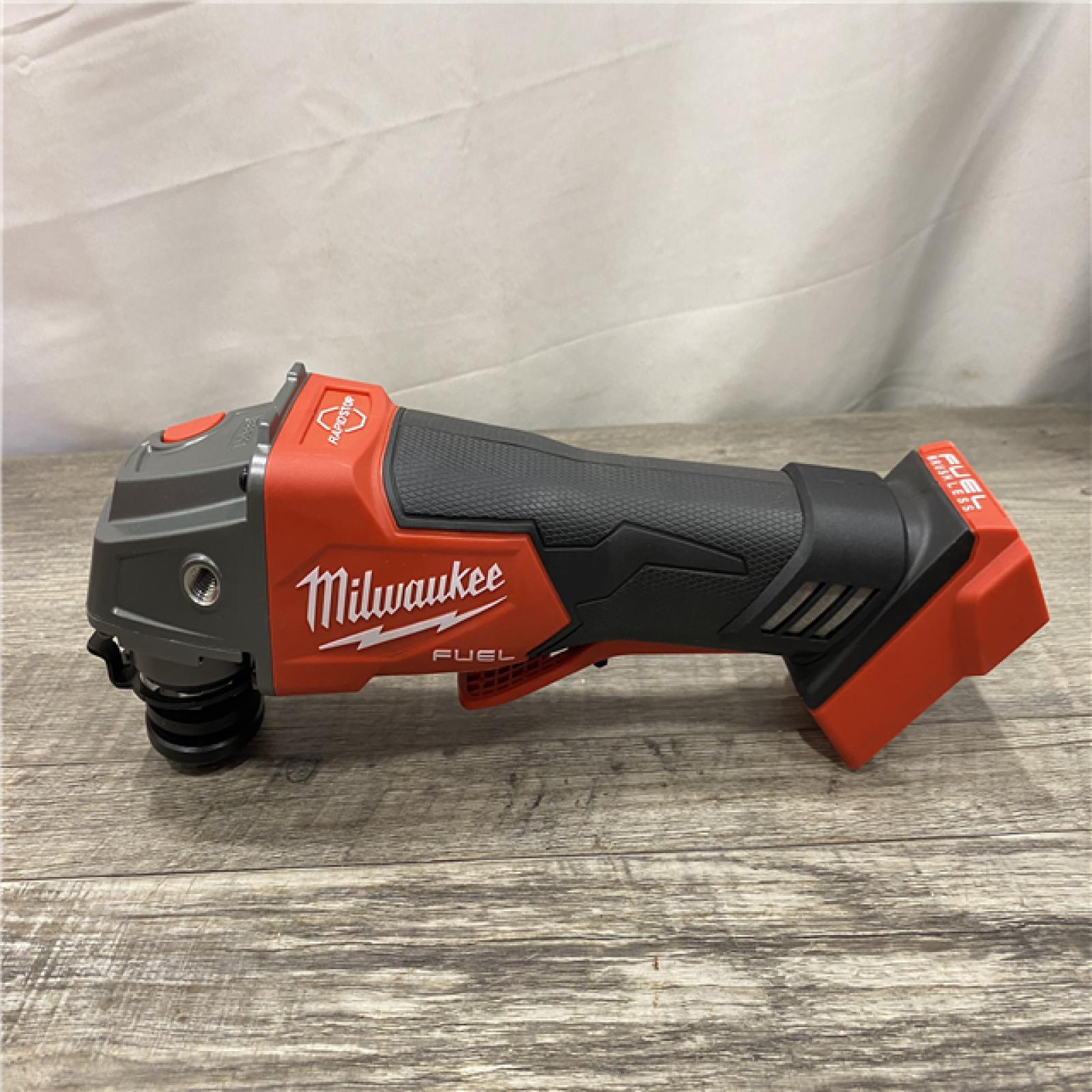 AS-IS Milwaukee FUEL 18V Lithium-Ion Brushless Cordless 4-1/2 in./5 in. Grinder w/Paddle Switch (Tool-Only)