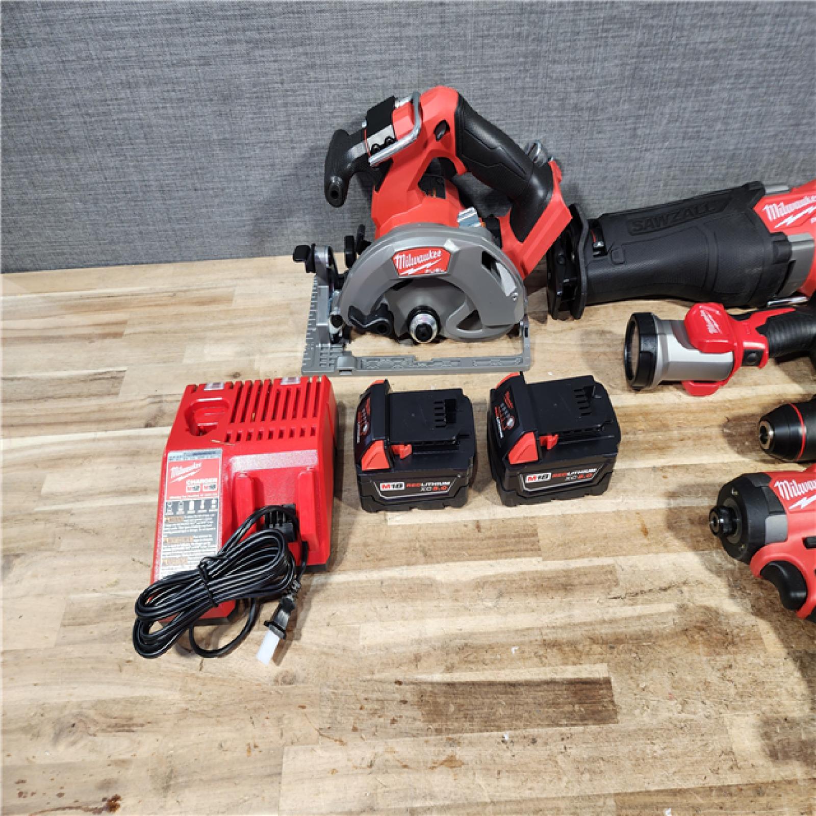 HOUSTON LOCATION - AS - IS M18 FUEL 18V Lithium-Ion Brushless Cordless 5-Tool Combo Kit with Two 5.0 Ah Batteries  1 Charger 1 Tool Bag