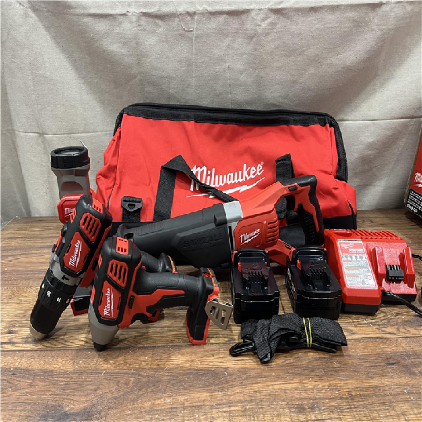 AS-IS MILWAUKEE M18 18V Lithium-Ion Cordless Combo Tool Kit with Two 3.0Ah Batteries, 1-Charger, 1-Tool Bag (4-Tool)