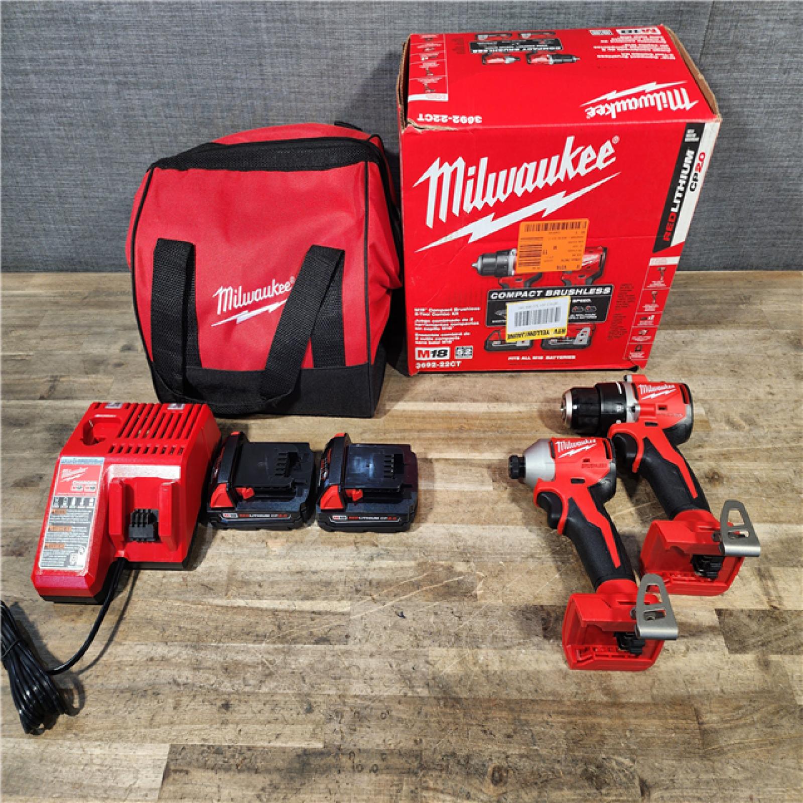 HOUSTON LOCATION - AS-IS Milwaukee M18 18V Lithium-Ion Brushless Cordless Compact Drill/Impact Combo Kit (2-Tool) W/(2) 2.0 Ah Batteries  Charger & Bag