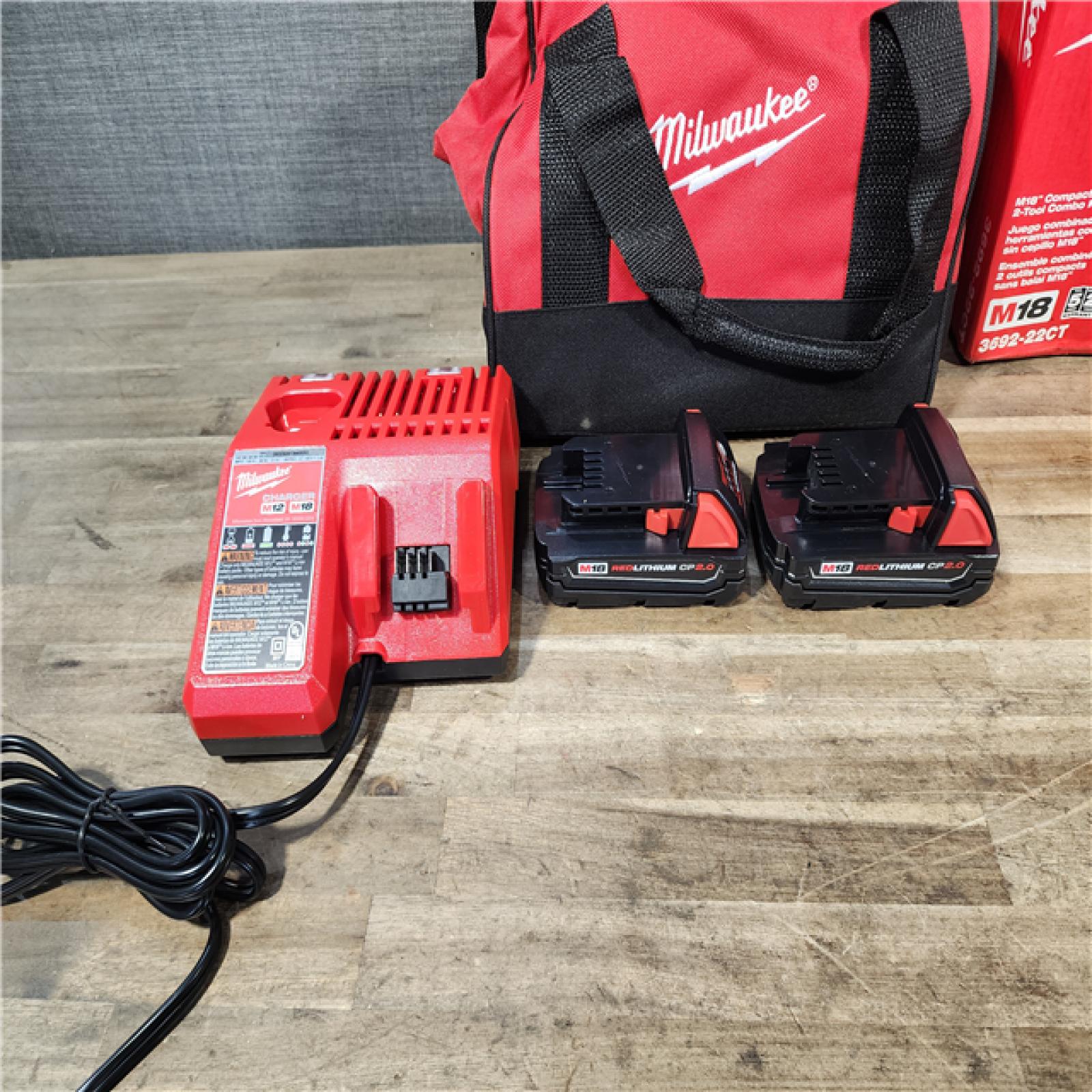 HOUSTON LOCATION - AS-IS Milwaukee M18 18V Lithium-Ion Brushless Cordless Compact Drill/Impact Combo Kit (2-Tool) W/(2) 2.0 Ah Batteries  Charger & Bag