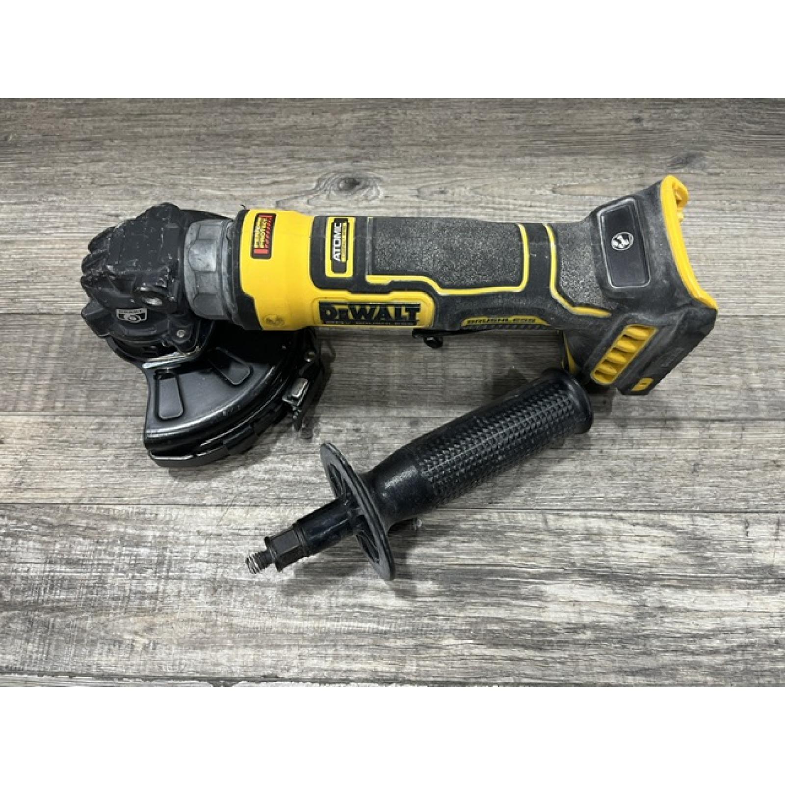 AS-IS DEWALT ATOMIC 20V MAX Cordless 4-1/2 in. Angle Grinder with Paddle Switch (Tool Only)