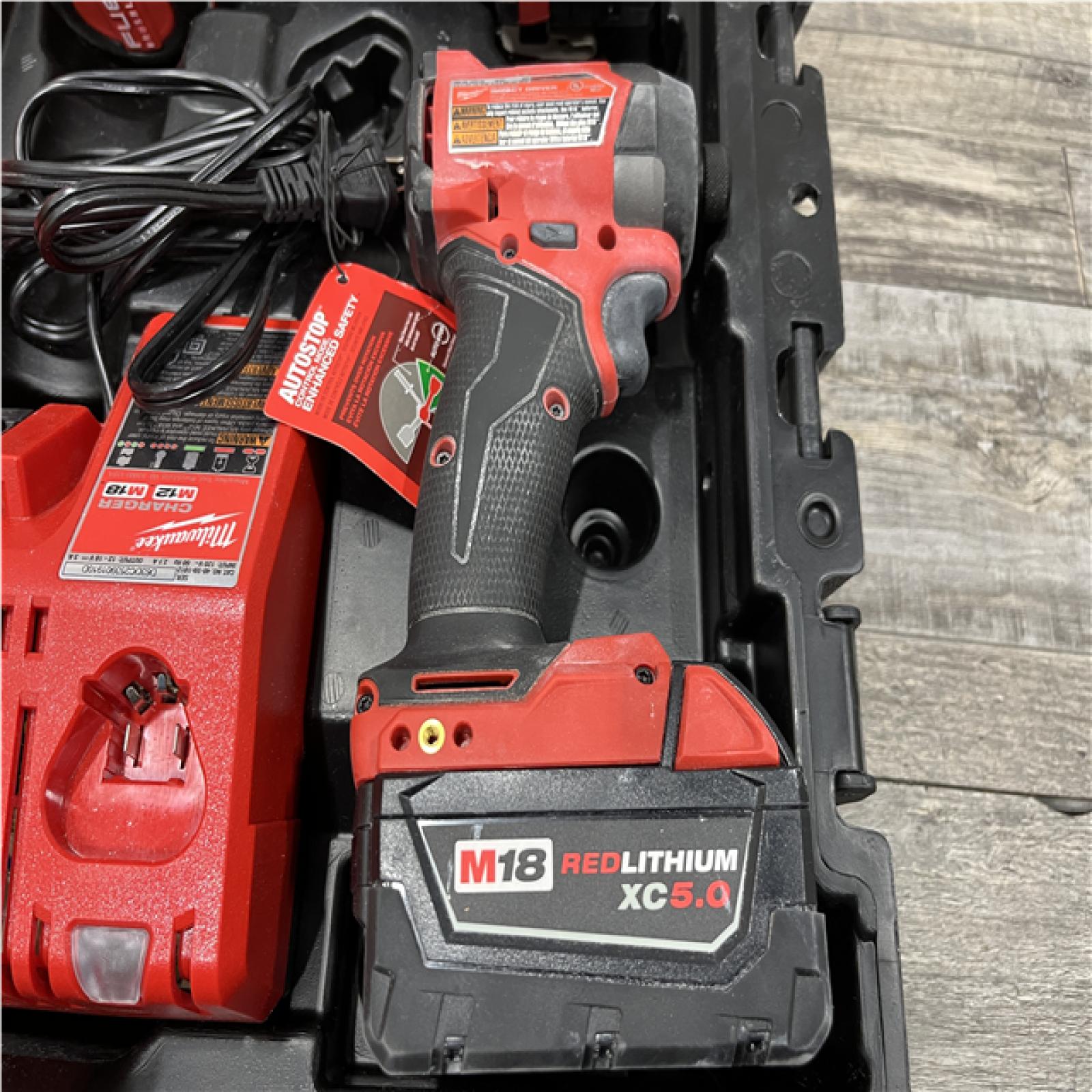 AS-IS Milwaukee FUEL 18V Lithium-Ion Brushless Cordless Hammer Drill and Impact Driver Combo Kit