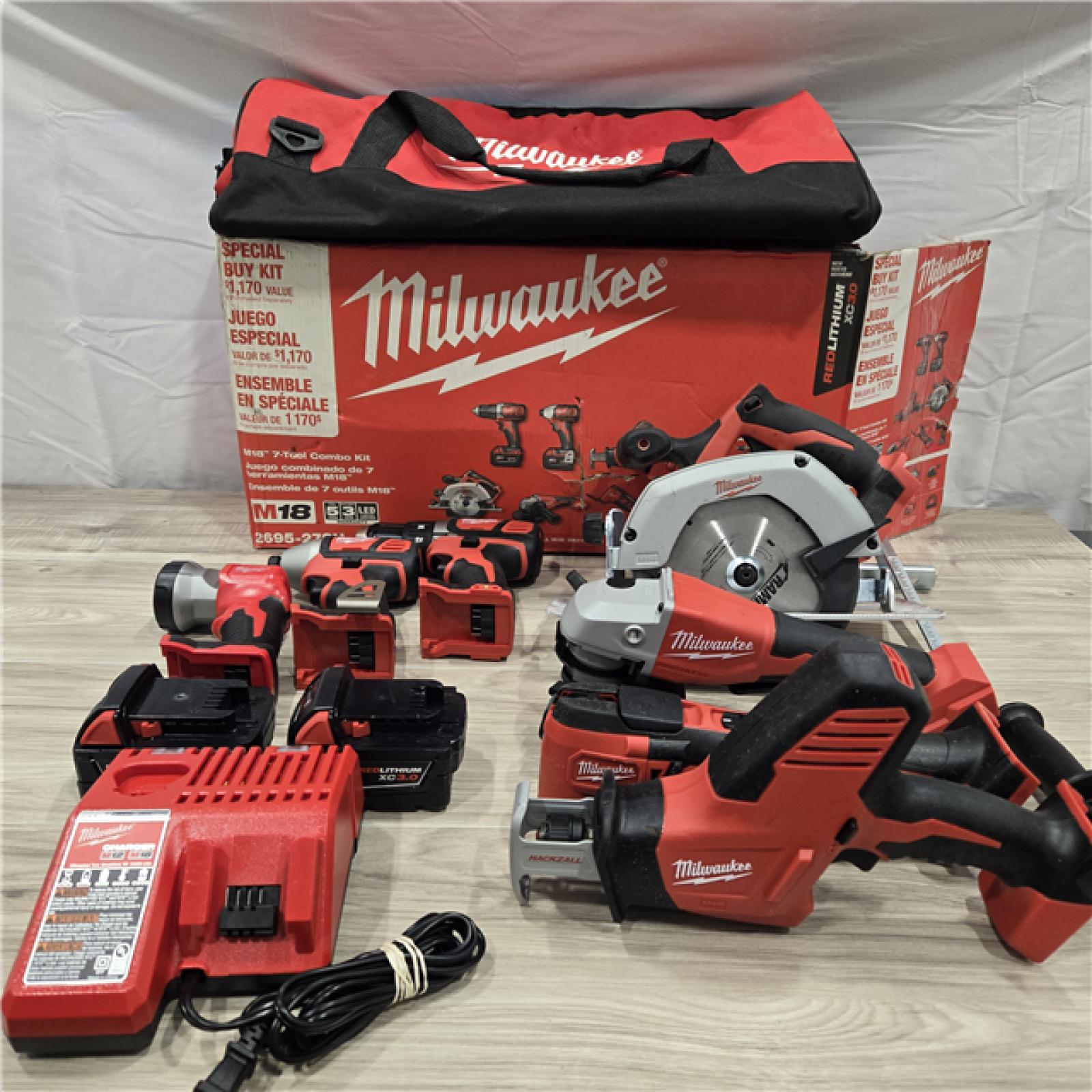 AS-IS  Milwaukee M18 18-Volt Lithium-Ion Cordless Combo Kit 7-Tool with 2-Batteries, Charger and Tool Bag