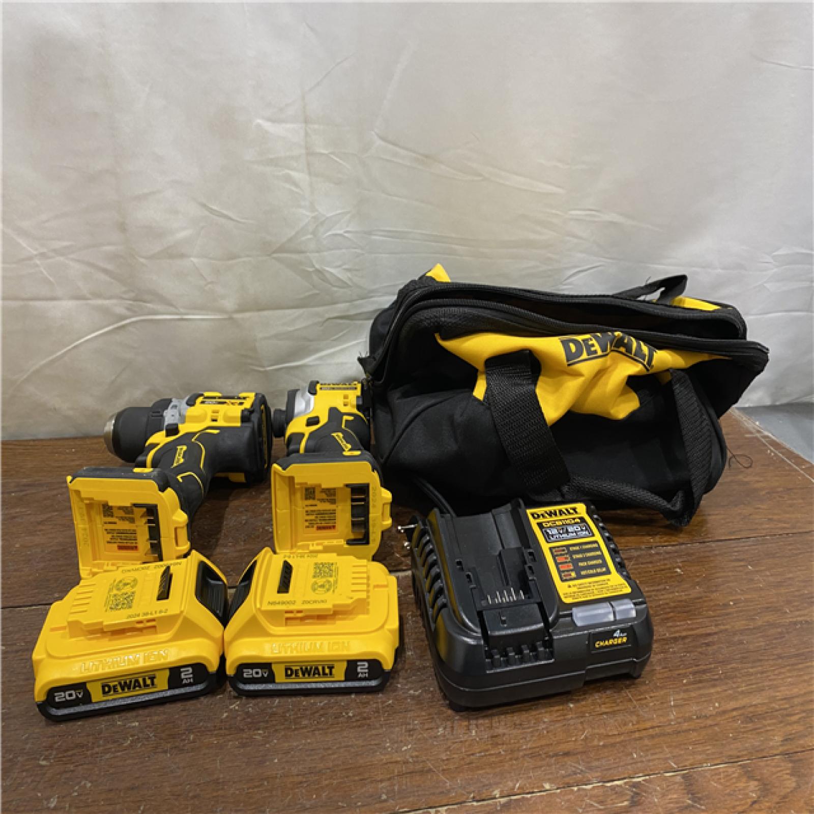 AS-IS DEWALT 20V MAX XR Cordless Drill/Driver, ATOMIC Impact Driver 2 Tool Combo Kit, (2) 2.0Ah Batteries, Charger, and Bag