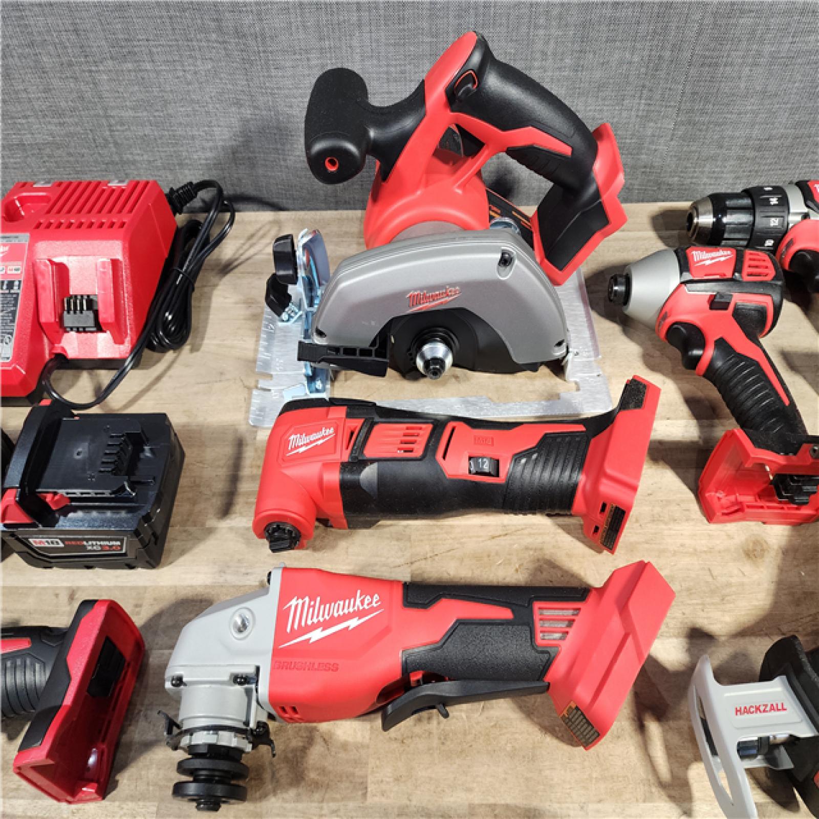 HOUSTON LOCATION - AS-IS (APPEARS LIKE NEW) Milwaukee M18 18-Volt Lithium-Ion Cordless Combo Kit 7-Tool with 2-Batteries, Charger and Tool Bag