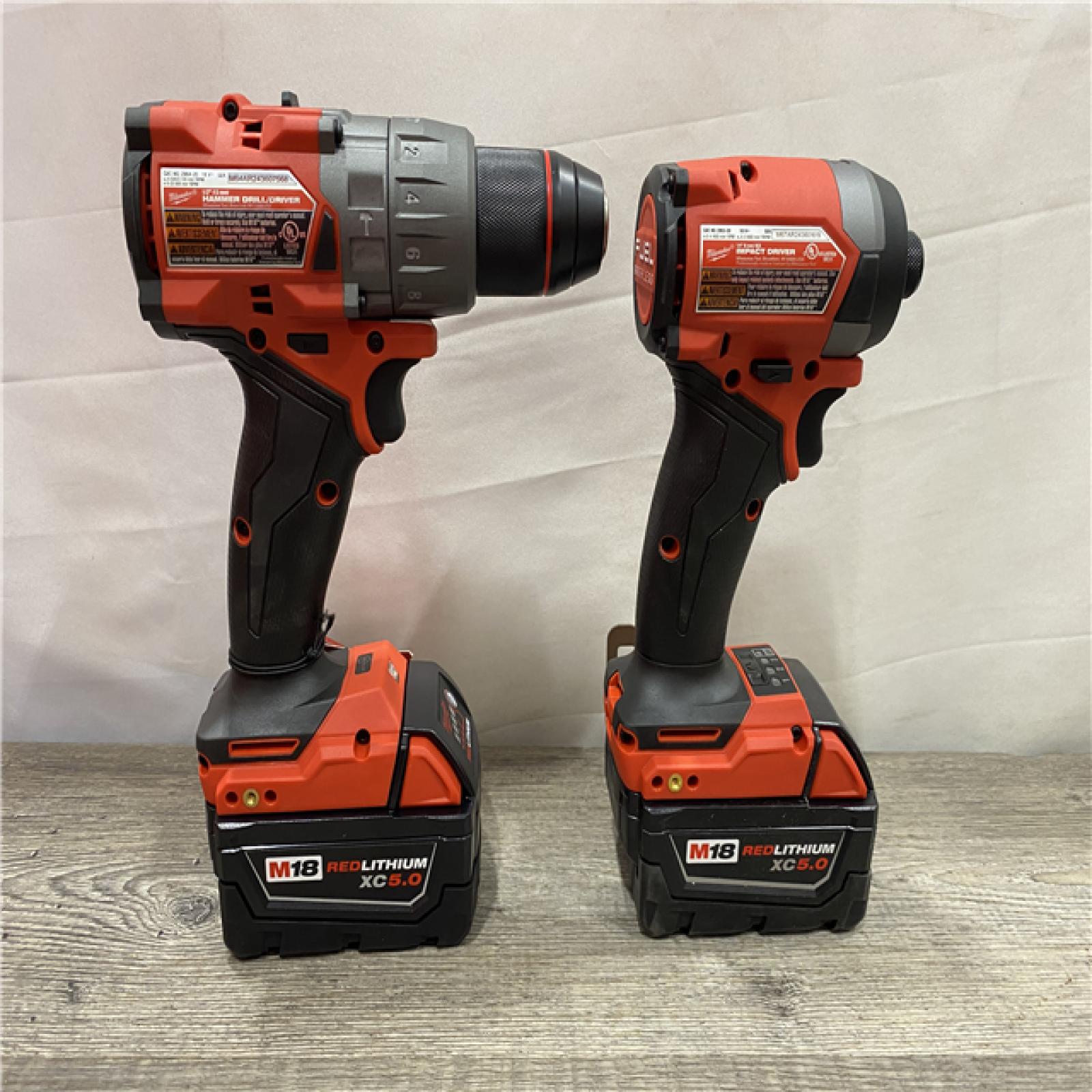 AS-IS Milwaukee FUEL 18V Lithium-Ion Brushless Cordless Hammer Drill and Impact Driver Combo Kit