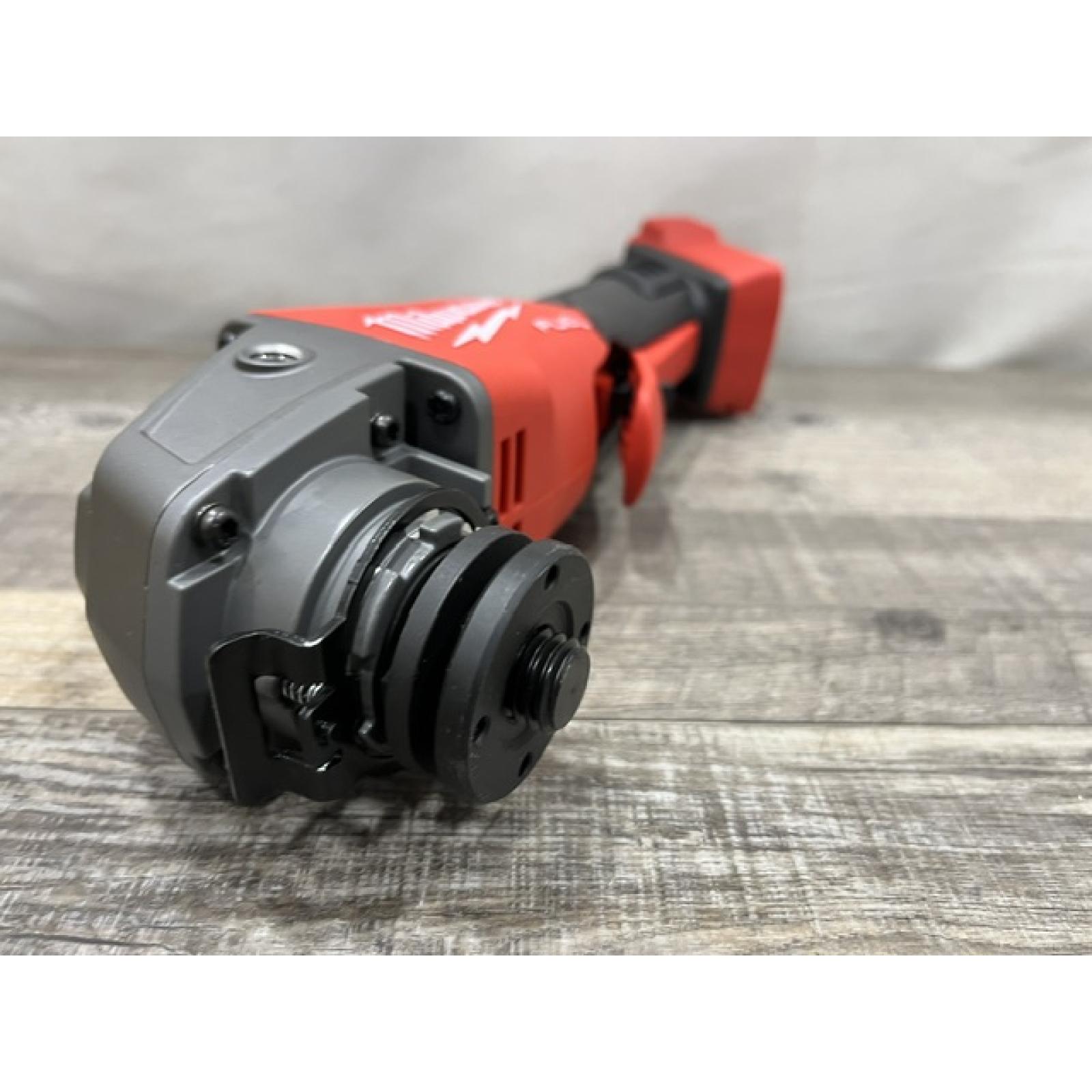 AS-IS Milwaukee FUEL 18V Lithium-Ion Brushless Cordless 4-1/2 in./5 in. Grinder w/Paddle Switch (Tool-Only)