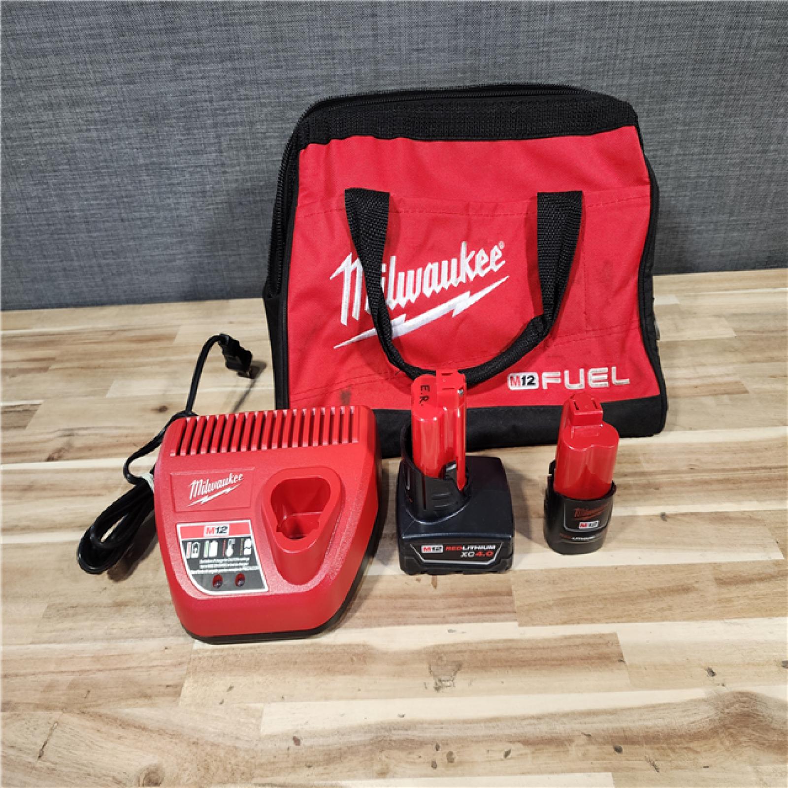 HOUSTON LOCATION - AS-IS Milwaukee FUEL 12-Volt Lithium-Ion Brushless Cordless Hammer Drill and Impact Driver Combo Kit