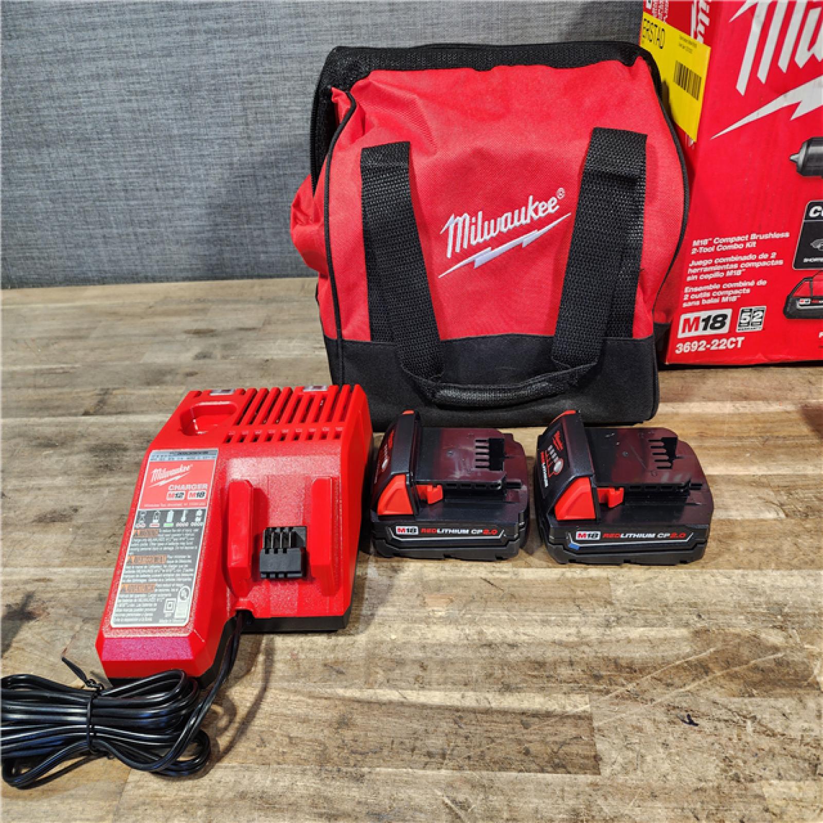 HOUSTON LOCATION - AS-IS Milwaukee M18 18V Lithium-Ion Brushless Cordless Compact Drill/Impact Combo Kit (2-Tool) W/(2) 2.0 Ah Batteries  Charger & Bag