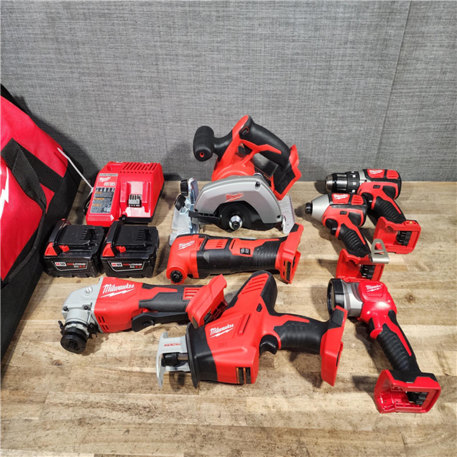 HOUSTON LOCATION - AS-IS MILWAUKEE 7 TOOL COMBO KIT W/ (2) BATTERY & CHARGER