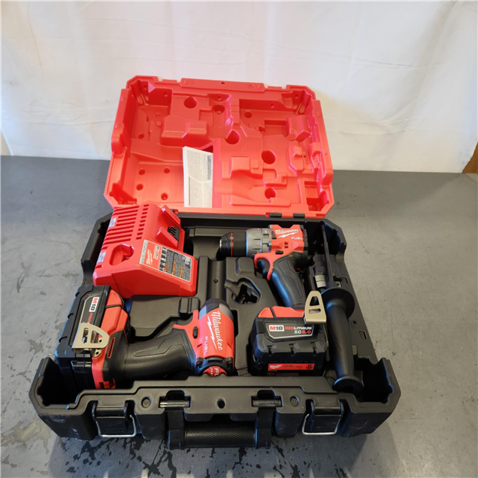 AS-IS- Milwaukee FUEL 18V Lithium-Ion Brushless Cordless Hammer Drill and Impact Driver Combo Kit