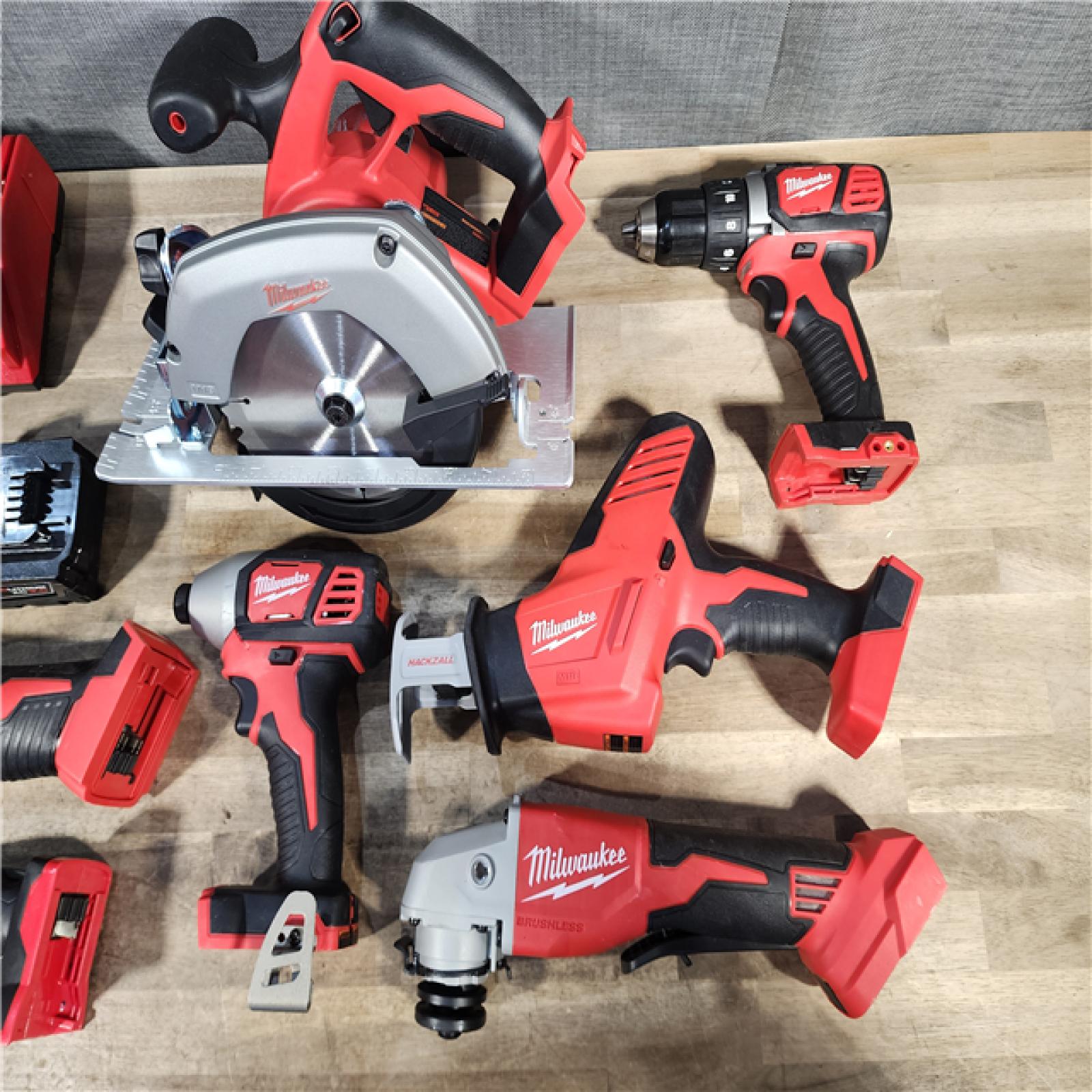 HOUSTON LOCATION - AS-IS Milwaukee M18 18-Volt Lithium-Ion Cordless Combo Kit 7-Tool with 2-Batteries, Charger and Tool Bag