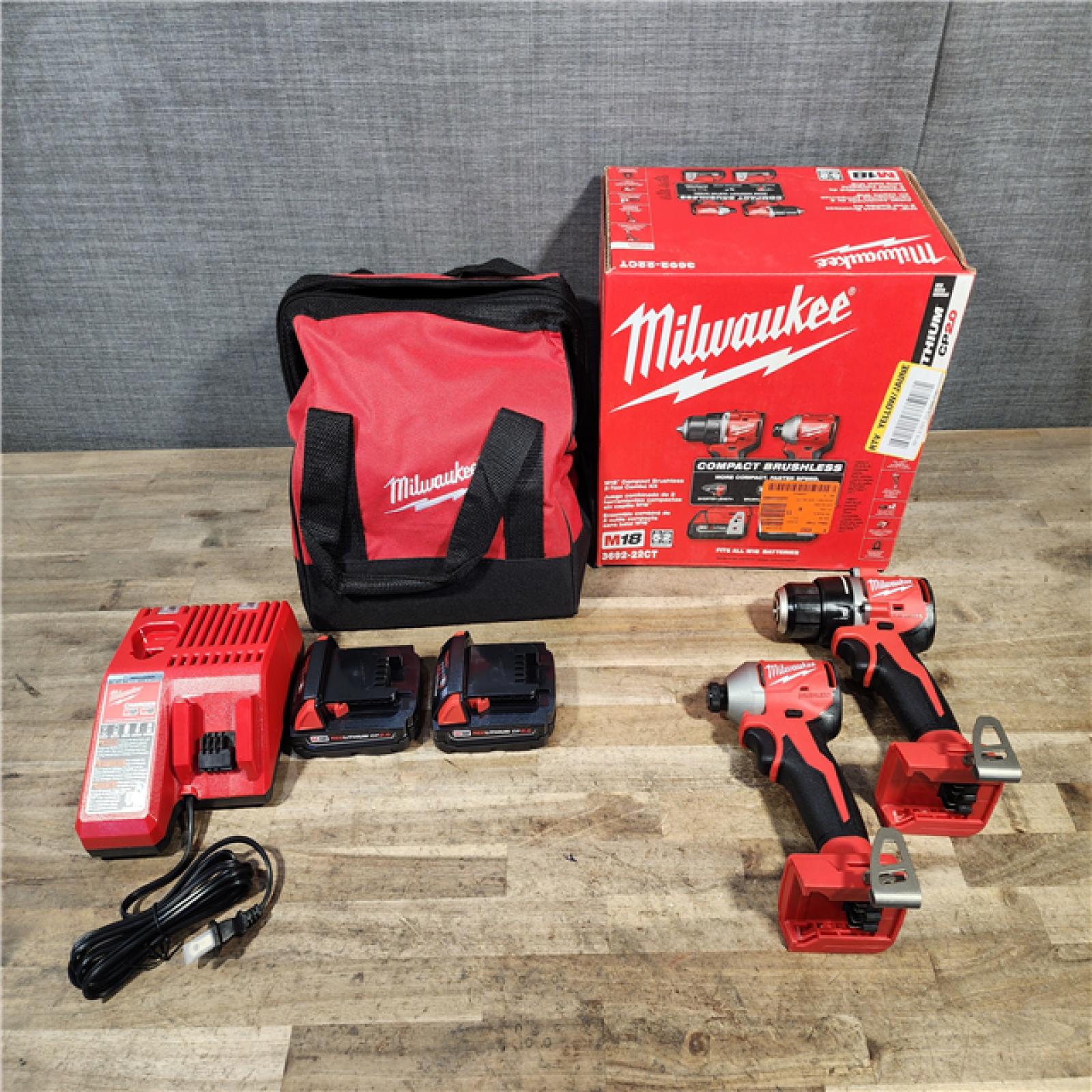 HOUSTON LOCATION - AS-IS Milwaukee M18 18V Lithium-Ion Brushless Cordless Compact Drill/Impact Combo Kit (2-Tool) W/(2) 2.0 Ah Batteries  Charger & Bag