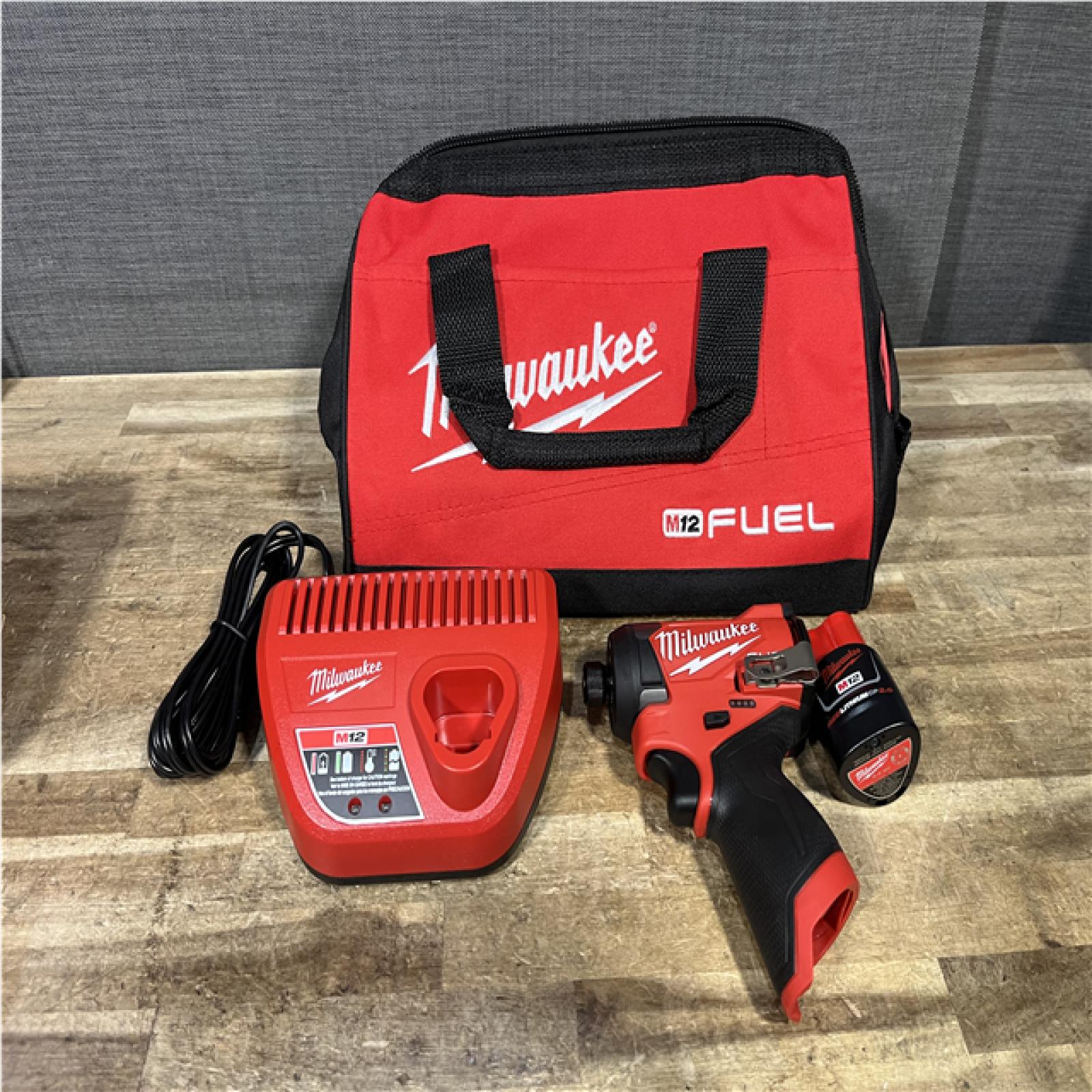 Houston Location AS-IS Milwaukee FUEL Impact Driver and Battery with Charger